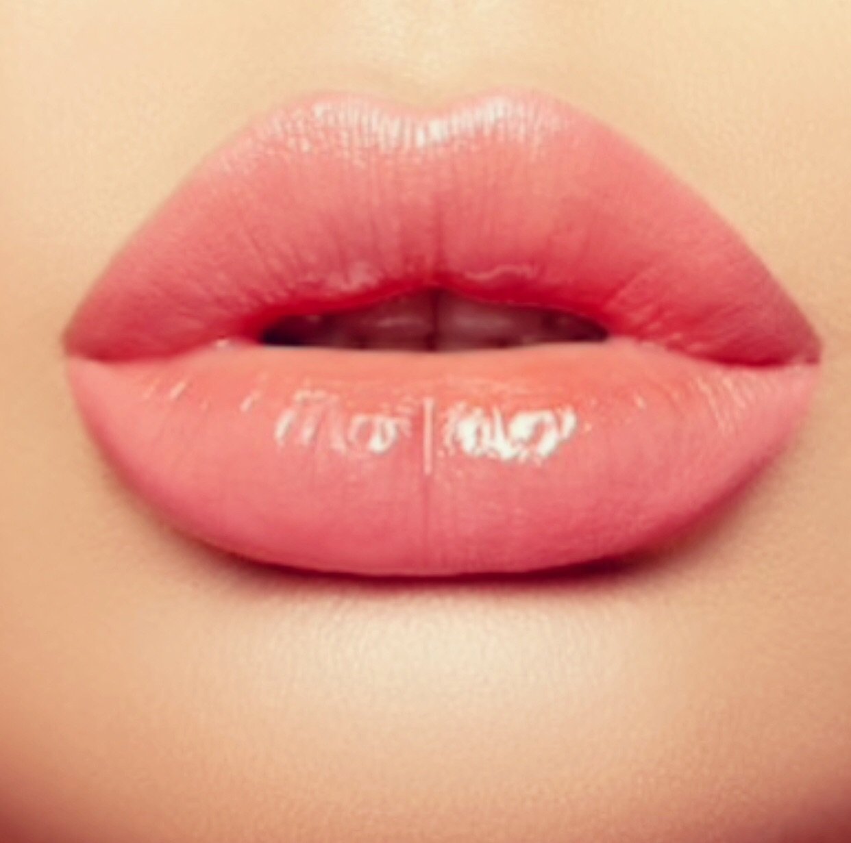 Lipgloss Disco in clear salmon melon shade with a creme texture, showcasing its glossy finish and stylish packaging.