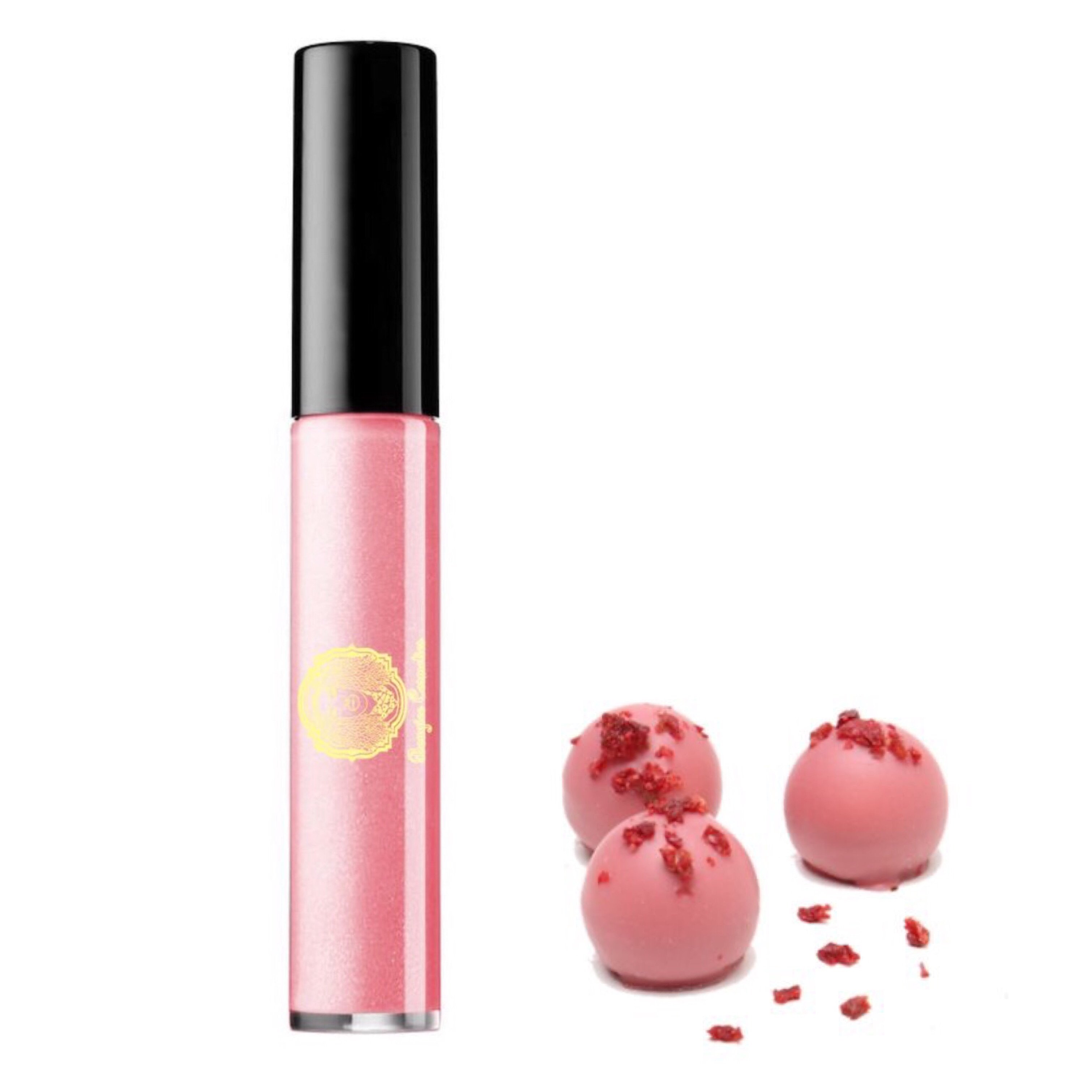 Lipgloss Disco in clear salmon melon shade with a creme texture, showcasing its glossy finish and stylish packaging.