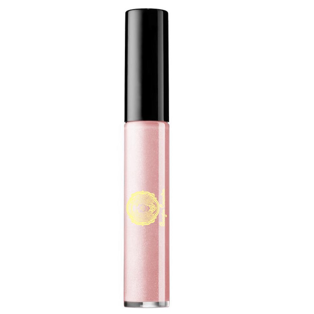 Nearly Naked Lipgloss in Mid Tone Nude Pink with a glossy finish, showcasing its creme texture and elegant packaging.