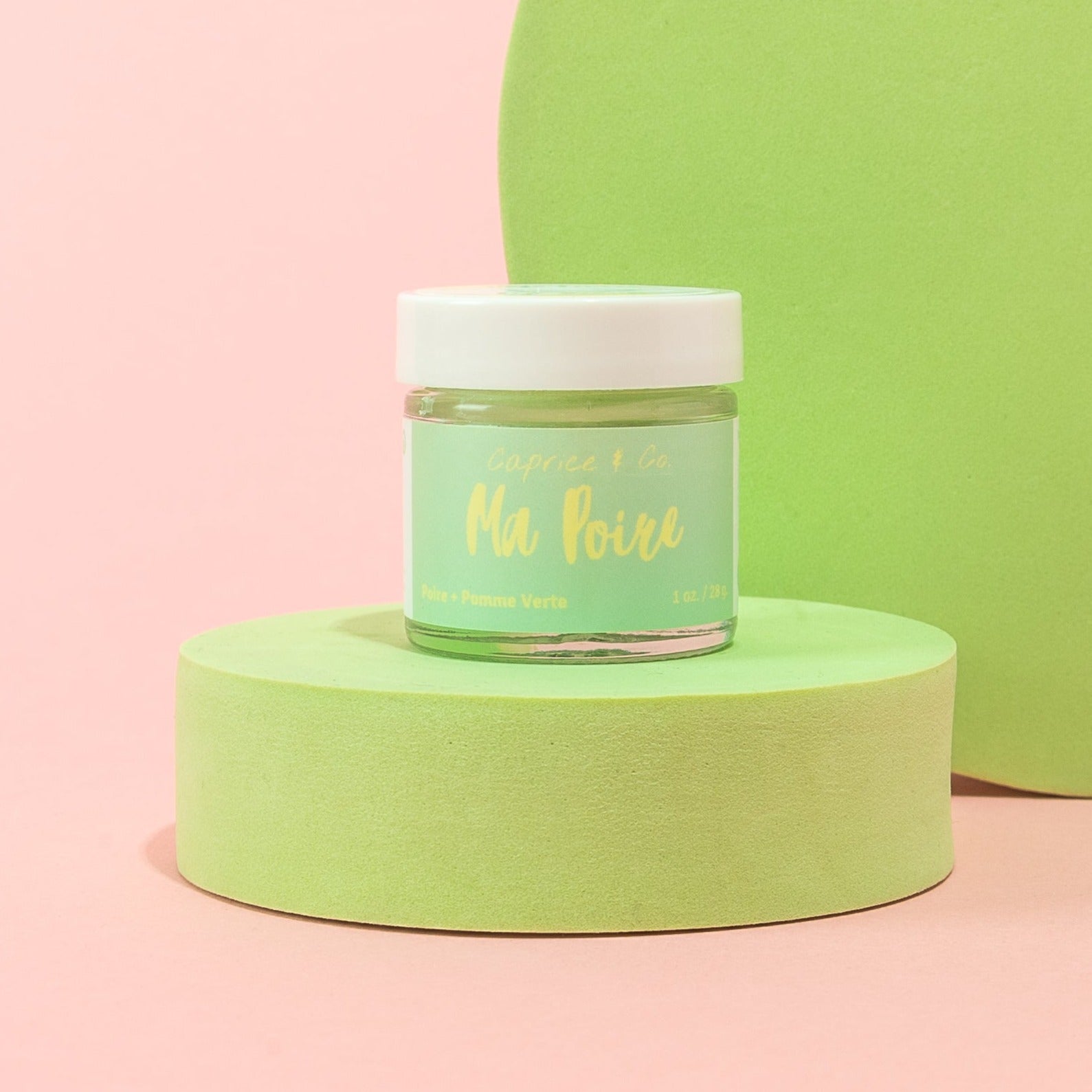 Ma Poire Lip Scrub in a jar with a pear and green apple flavor, showcasing its natural ingredients and handmade quality.