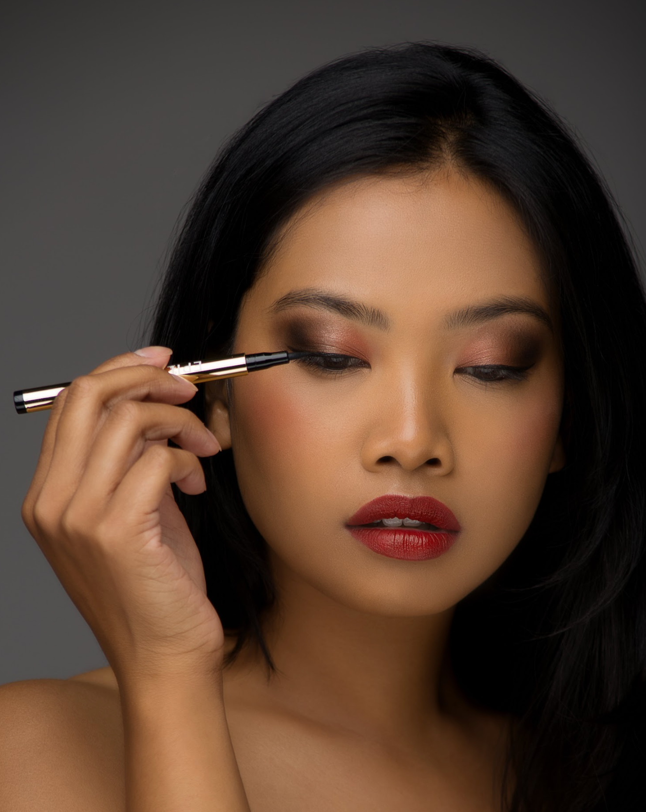 A collection of EpiLynx Liquid Eyeliner Pens in various vibrant colors including royal blue, spring green, and royal purple, showcasing their precise applicator tips.