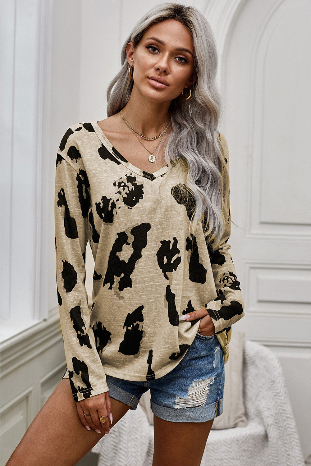 A stylish long sleeves leopard print blouse featuring a V-neck design and loose fit, perfect for casual and trendy outfits.