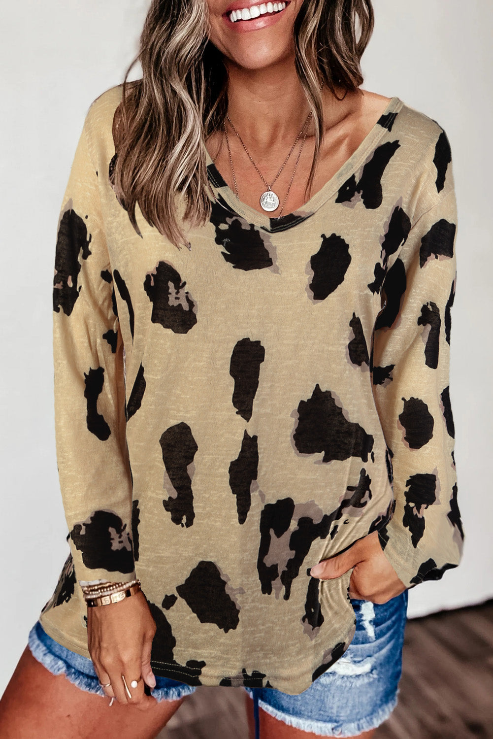 A stylish long sleeves leopard print blouse featuring a V-neck design and loose fit, perfect for casual and trendy outfits.