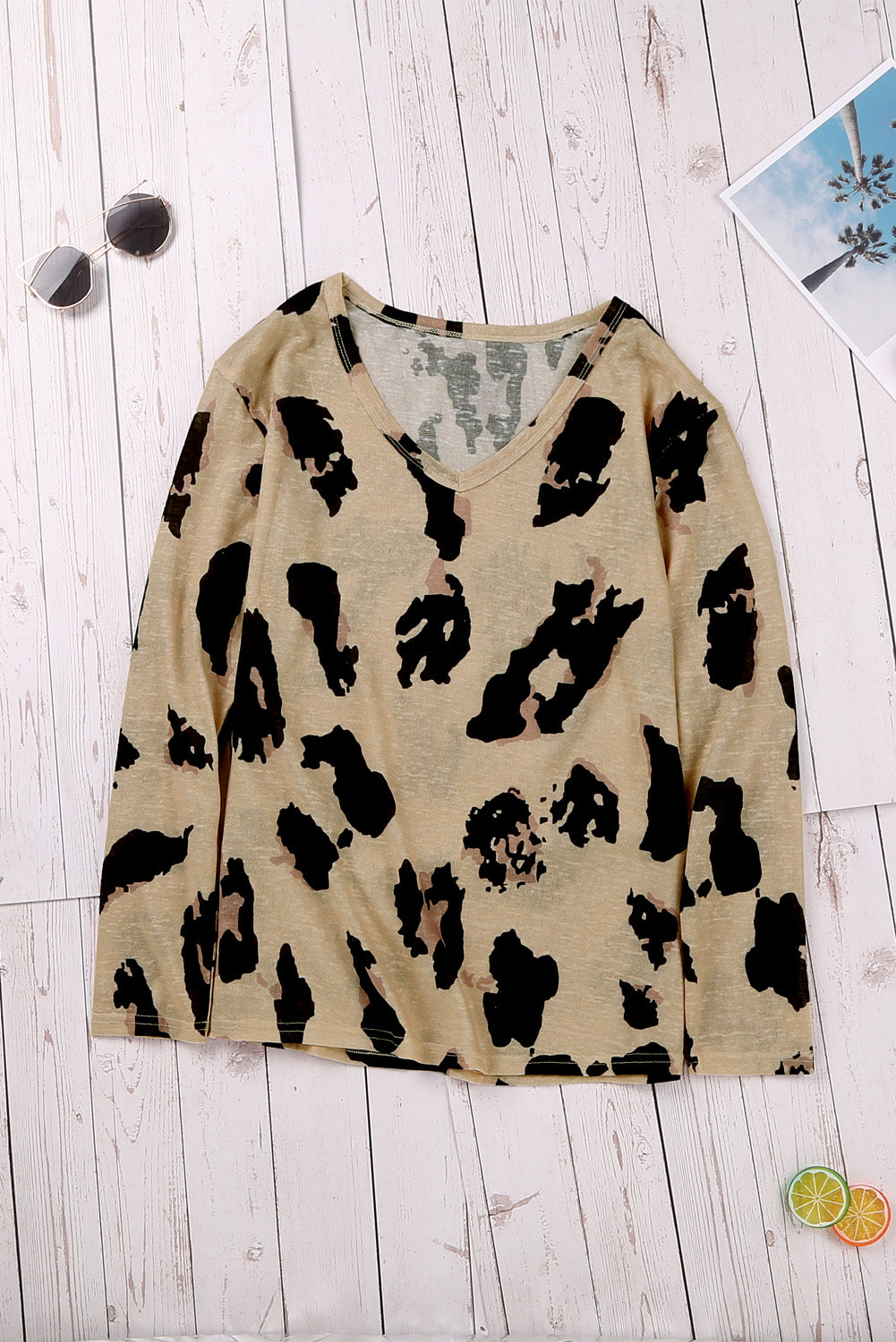 A stylish long sleeves leopard print blouse featuring a V-neck design and loose fit, perfect for casual and trendy outfits.