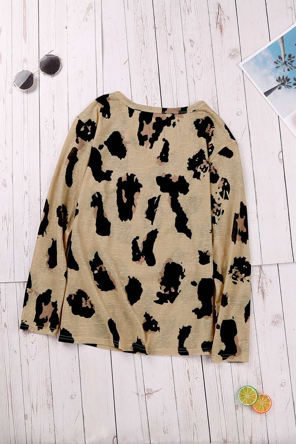 A stylish long sleeves leopard print blouse featuring a V-neck design and loose fit, perfect for casual and trendy outfits.