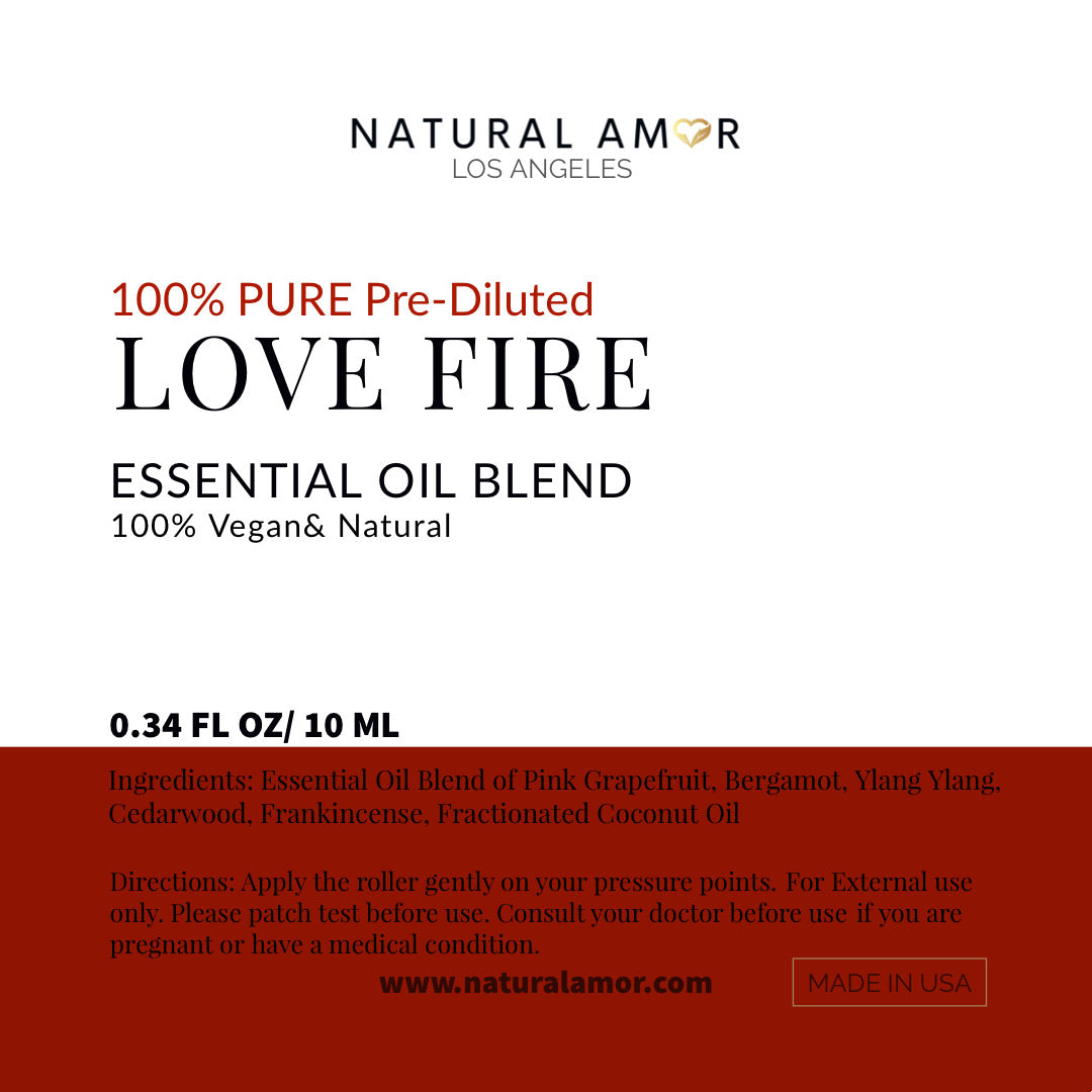 Love Fire Roll On Essential Oil Blend in a 10 mL bottle with a stainless steel rollerball, featuring a floral and woodsy scent.