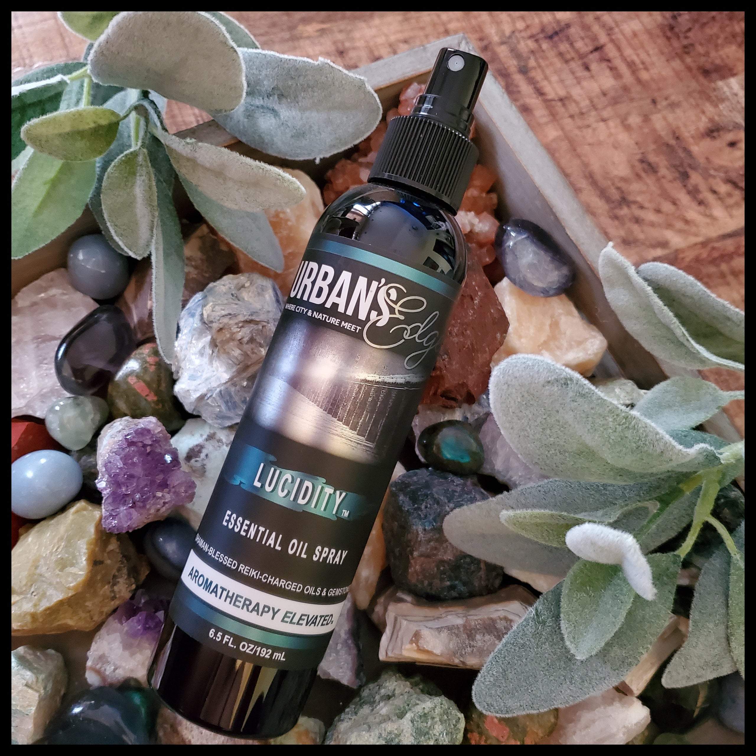 Lucidity Essential Oil Spray bottle with a calming design, featuring essential oils and gemstones for enhanced dream awareness.