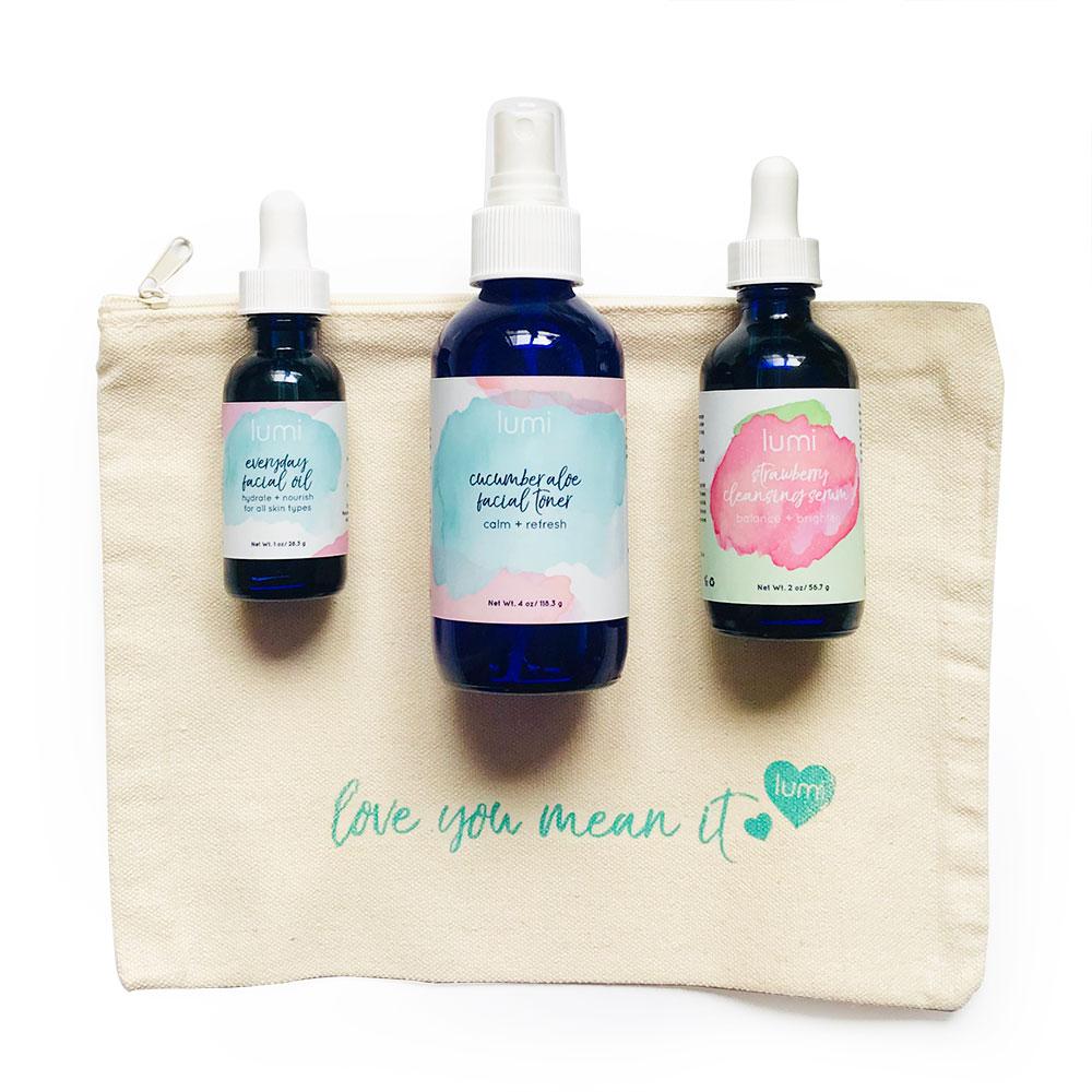 Lumi Basics Starter Kit featuring a canvas bag with cleansing serum, toner, and facial oil for glowing skin.