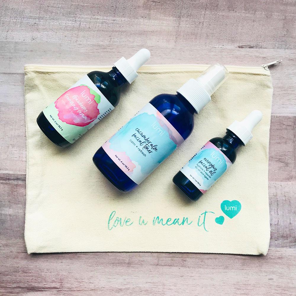 Lumi Basics Starter Kit featuring a canvas bag with cleansing serum, toner, and facial oil for glowing skin.