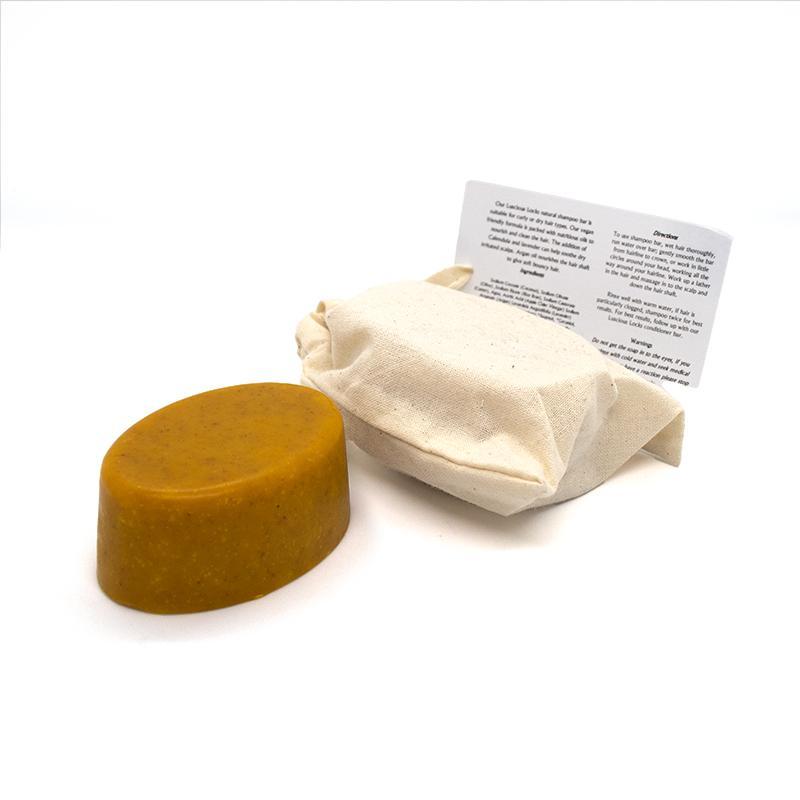 Luscious Locks Organic Shampoo Bar with natural ingredients, suitable for curly and dry hair types, packaged in eco-friendly cotton bag.