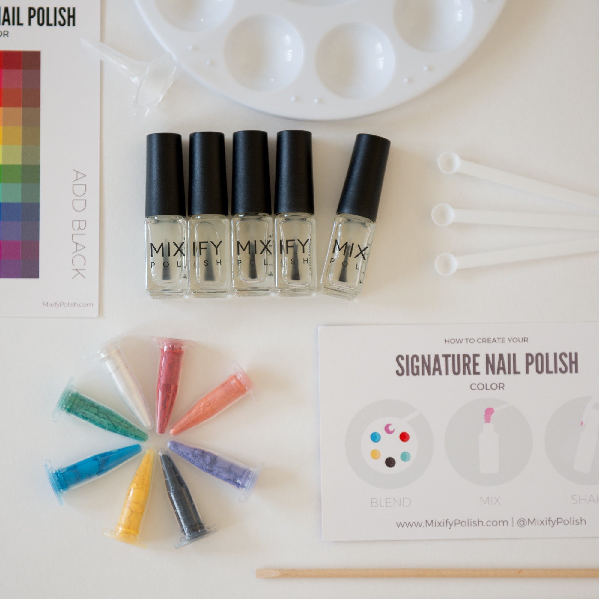 Make Your Own Nail Polish Kit in a limited edition tin with colorful pigments and tools for creating custom nail polish.