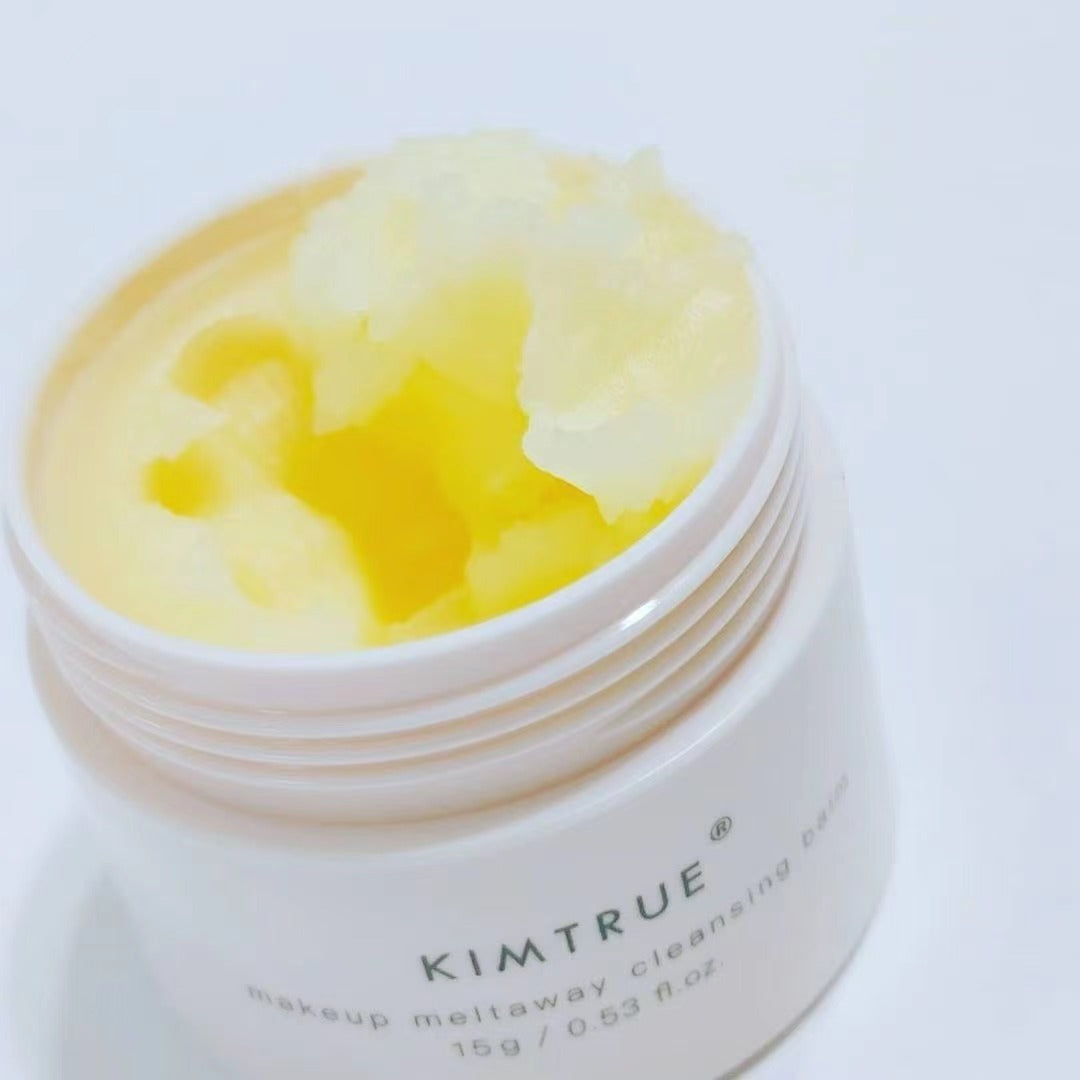 Makeup Meltaway Cleansing Balm in a sealed plastic container, showcasing its rich texture and natural ingredients like bilberry and moringa seed extracts.