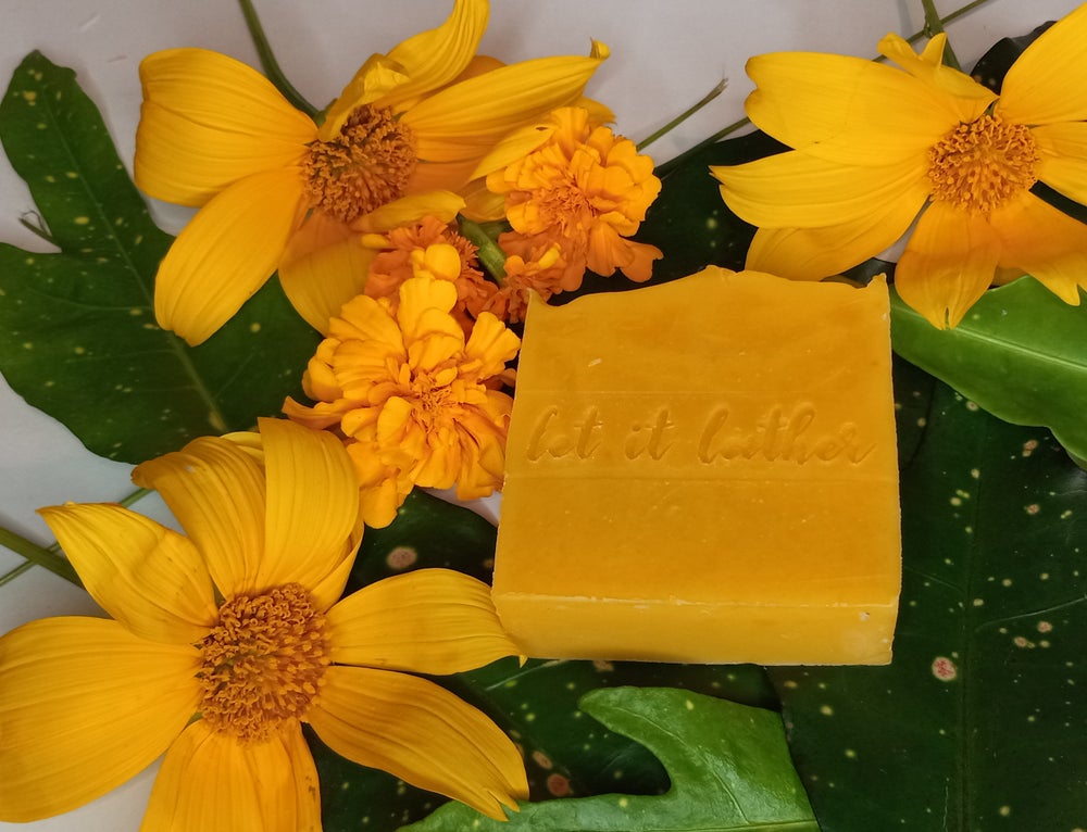 Mango Bath Soap bar with organic mango and sweet orange essential oil, showcasing its creamy texture and vibrant color.