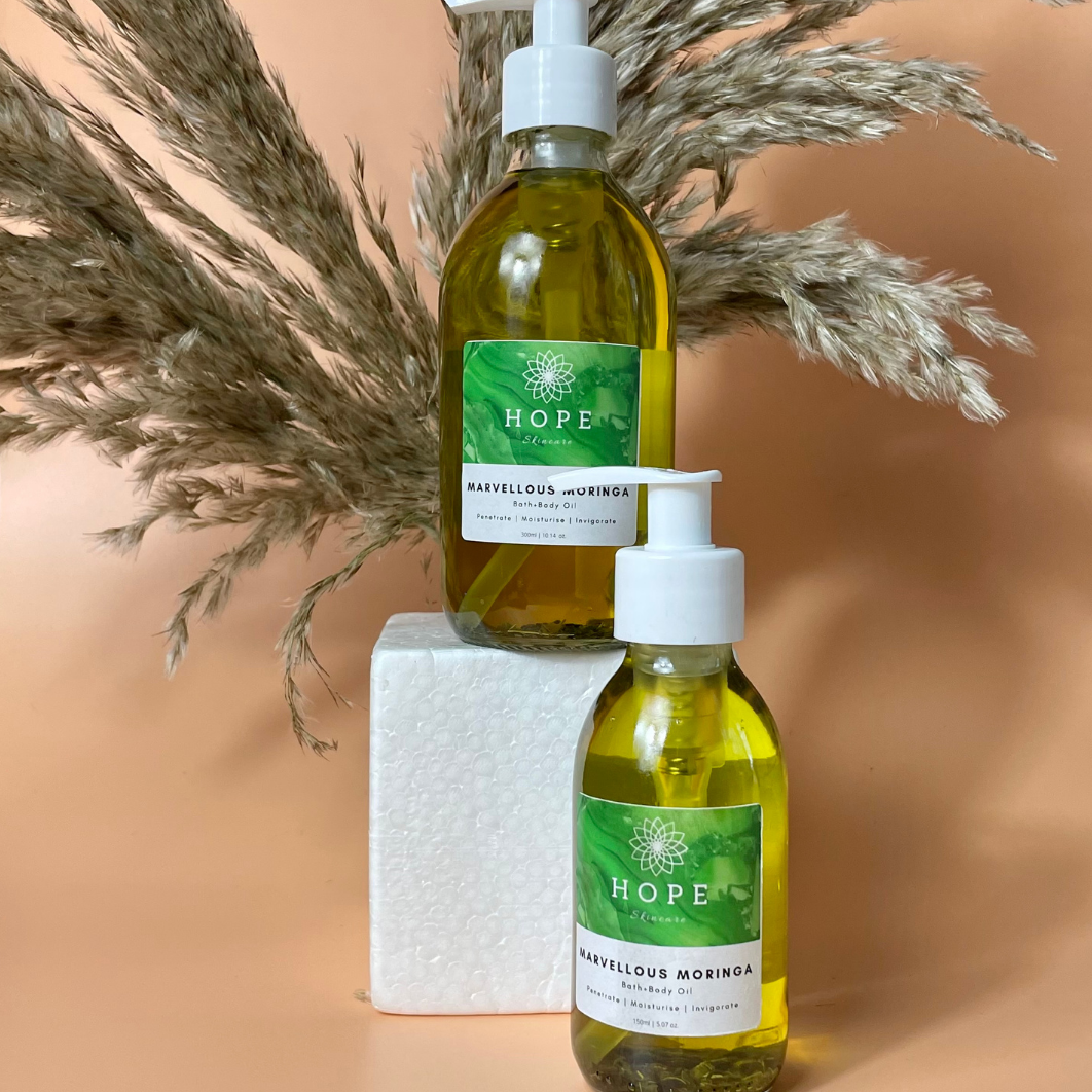 Bottle of Marvellous Moringa Bath + Body Oil with a rich blend of nourishing oils for skin hydration.