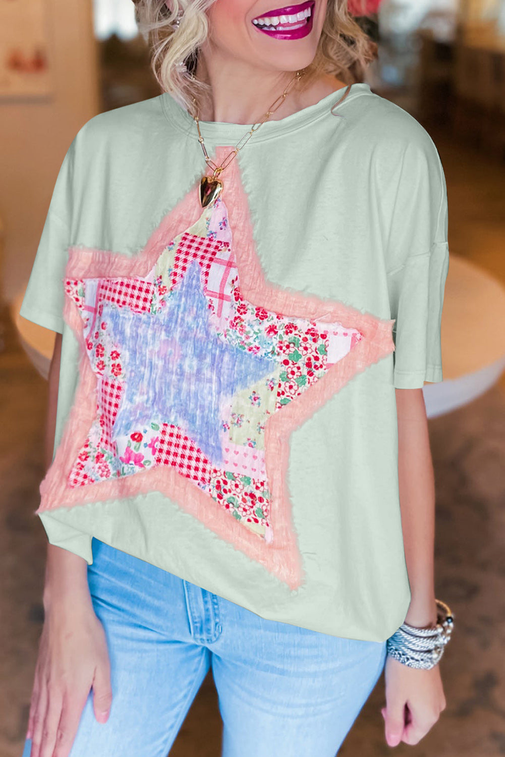 Meadow Mist Green Star Patchwork Loose T-shirt featuring a unique star design and a relaxed fit, perfect for casual wear.