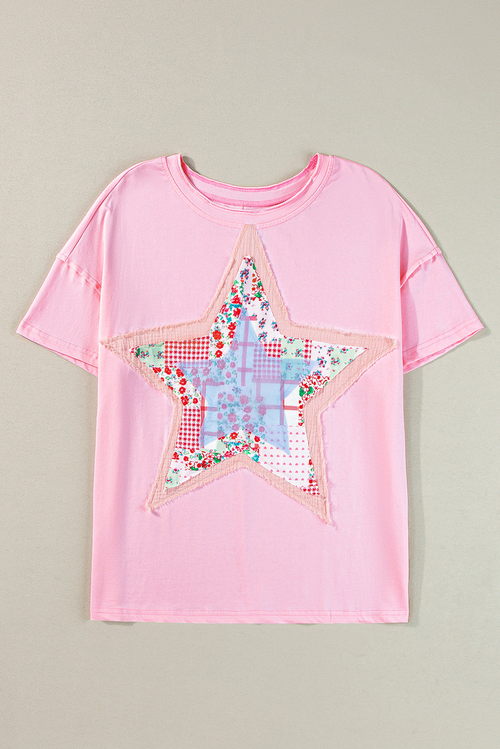 Meadow Mist Green Star Patchwork Loose T-shirt featuring a unique star design and a relaxed fit, perfect for casual wear.