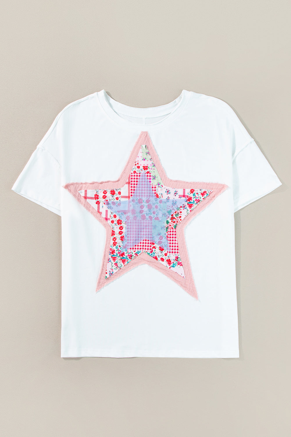 Meadow Mist Green Star Patchwork Loose T-shirt featuring a unique star design and a relaxed fit, perfect for casual wear.