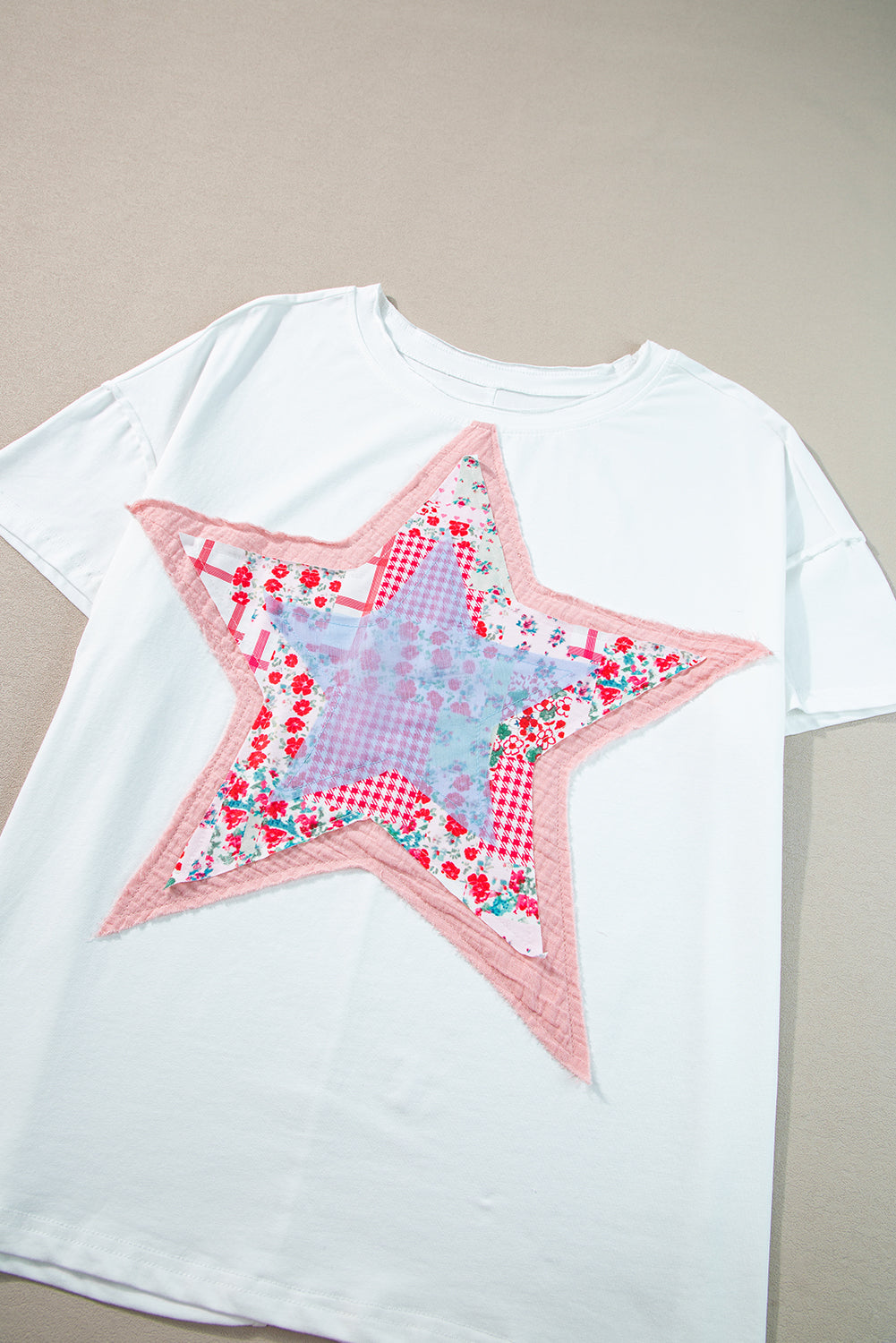 Meadow Mist Green Star Patchwork Loose T-shirt featuring a unique star design and a relaxed fit, perfect for casual wear.