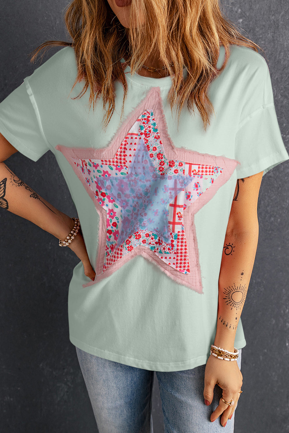 Meadow Mist Green Star Patchwork Loose T-shirt featuring a unique star design and a relaxed fit, perfect for casual wear.