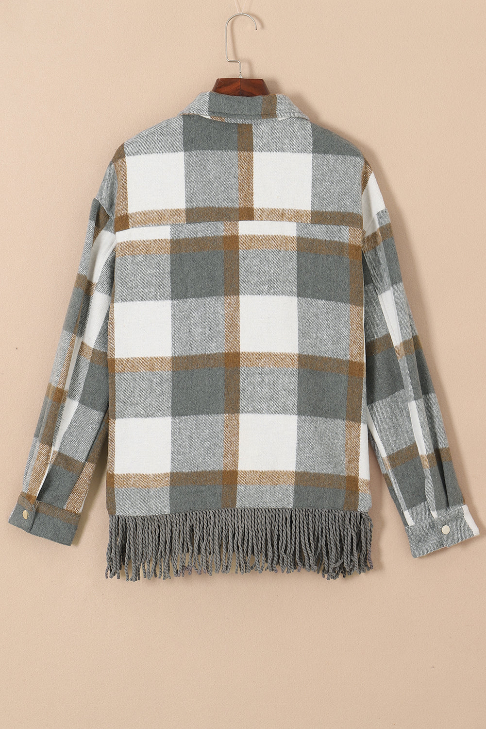 A stylish medium grey plaid jacket featuring a fringed hem, metal snap buttons, and two chest pockets, perfect for layering.