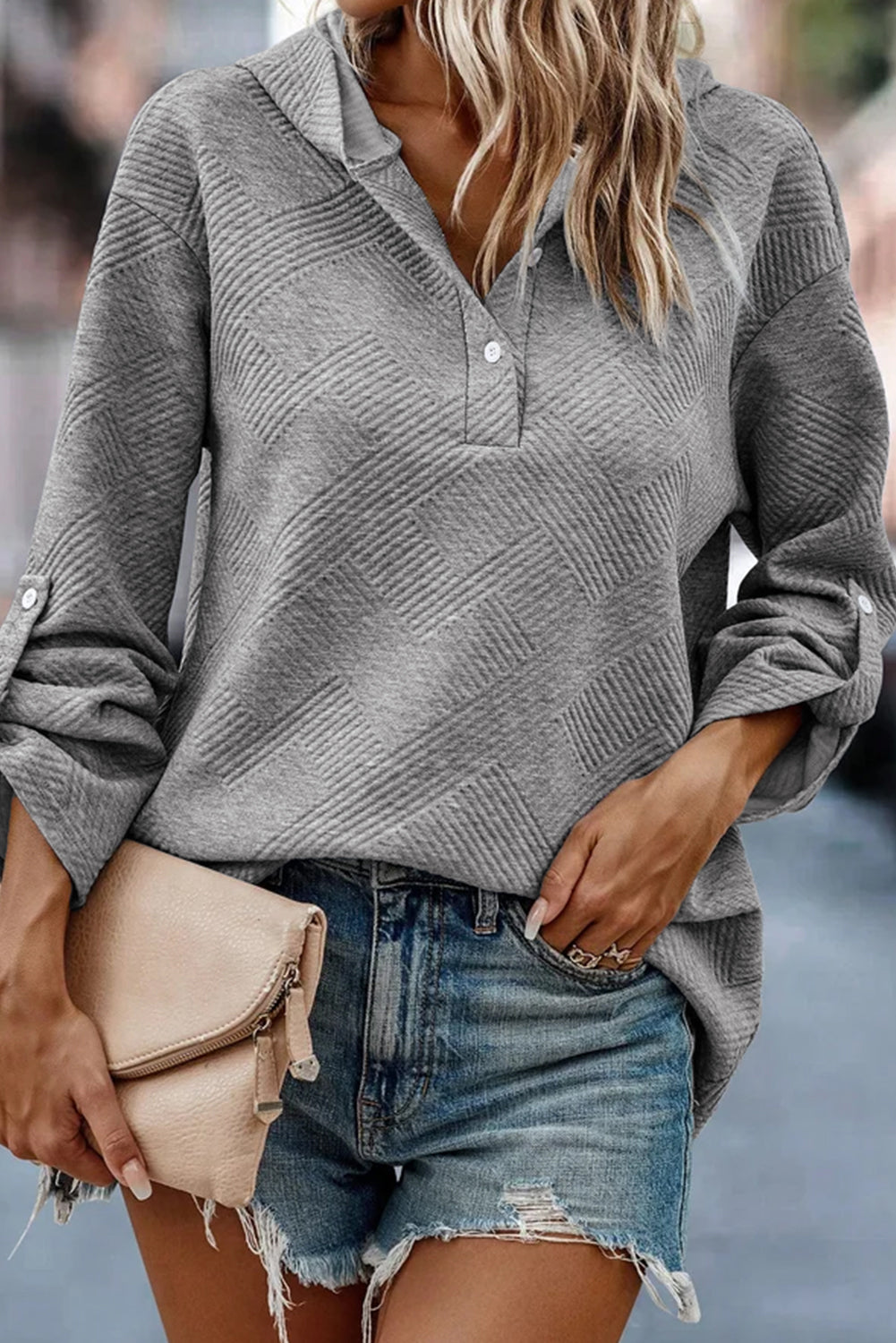 Medium grey pullover hoodie with textured knit and pin-up sleeves, featuring buttons for easy wear.