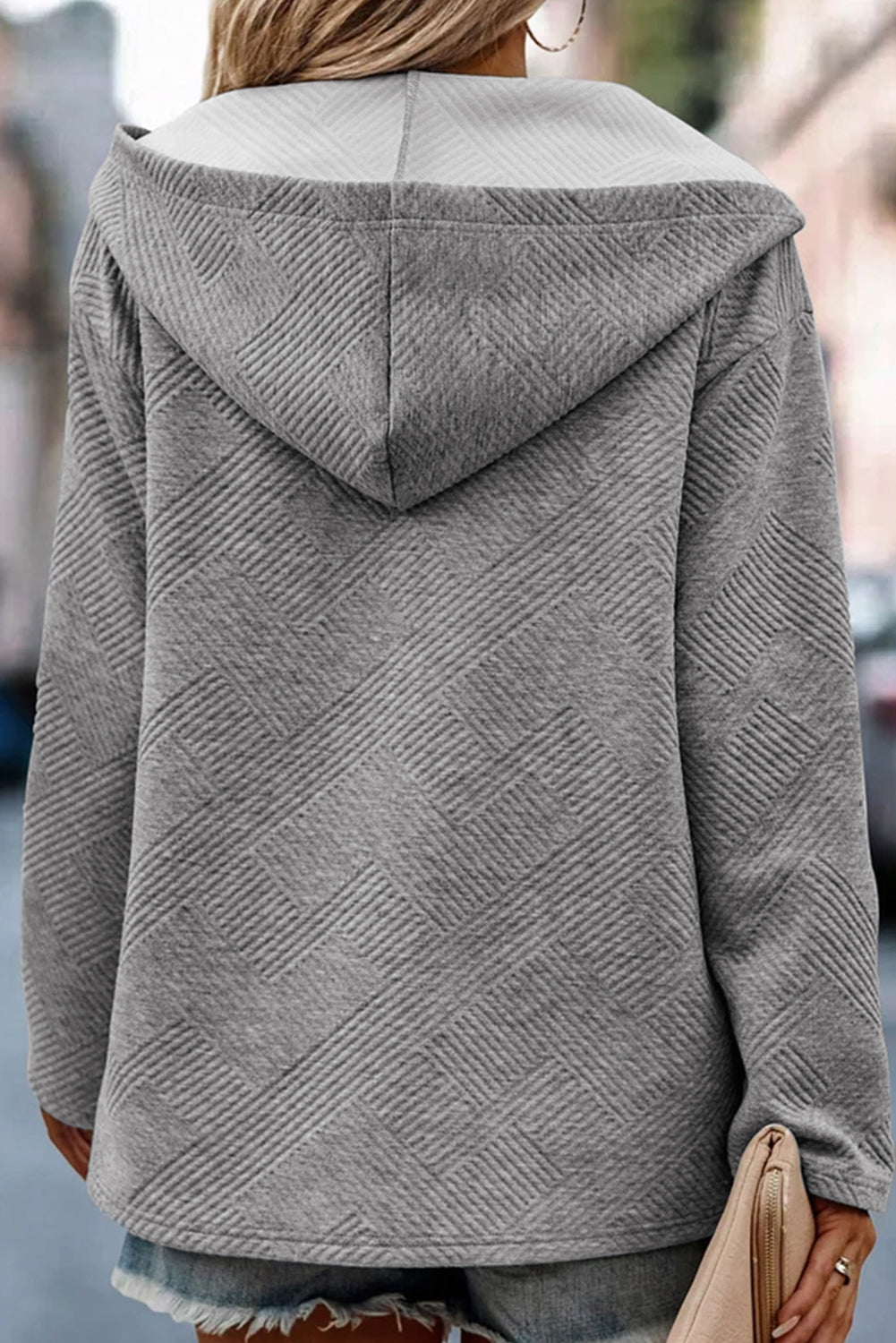 Medium grey pullover hoodie with textured knit and pin-up sleeves, featuring buttons for easy wear.