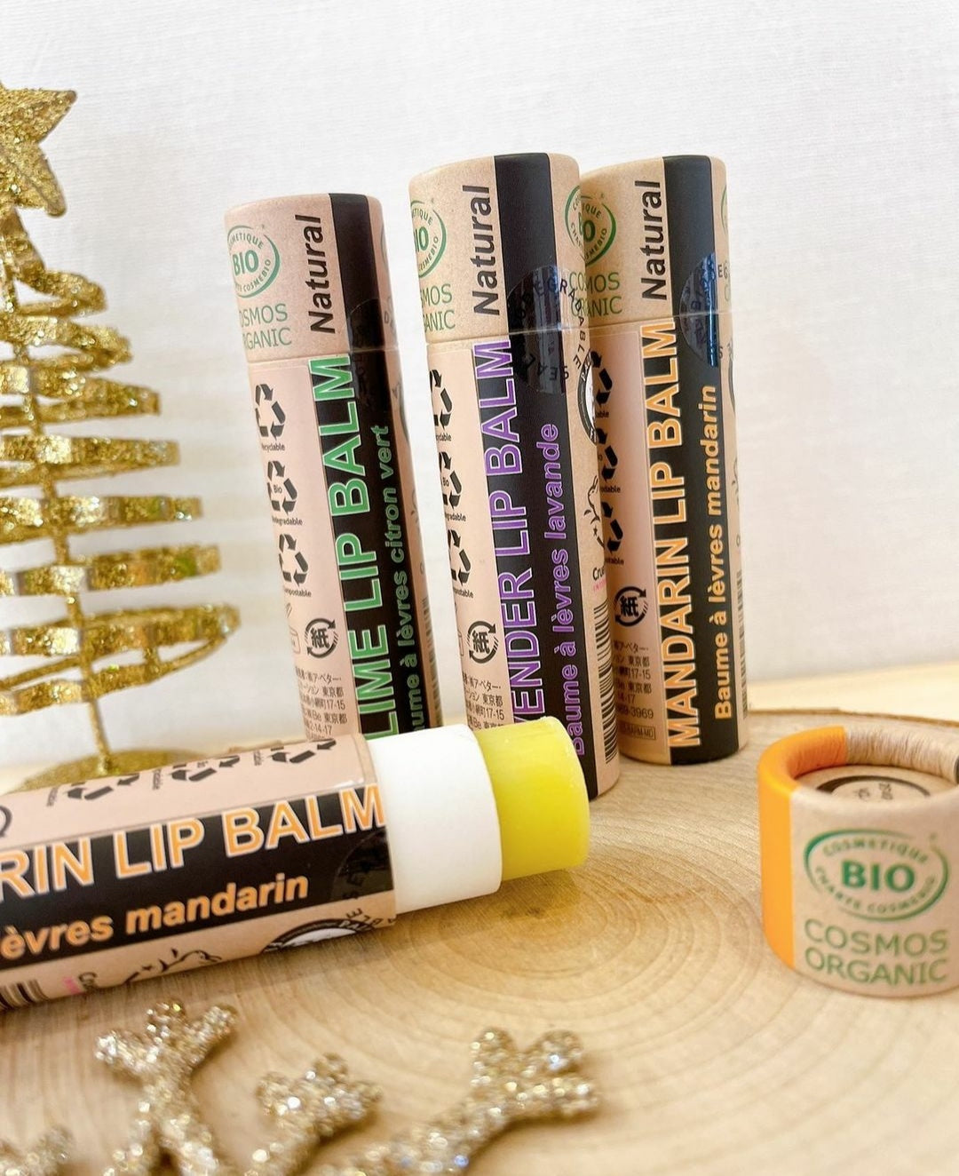 A collection of 30 x 15ml Organic Lavender Lip Balms in eco-friendly packaging, showcasing their natural ingredients and soothing lavender scent.