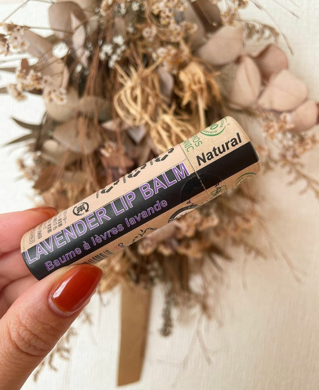 A collection of 30 x 15ml Organic Lavender Lip Balms in eco-friendly packaging, showcasing their natural ingredients and soothing lavender scent.