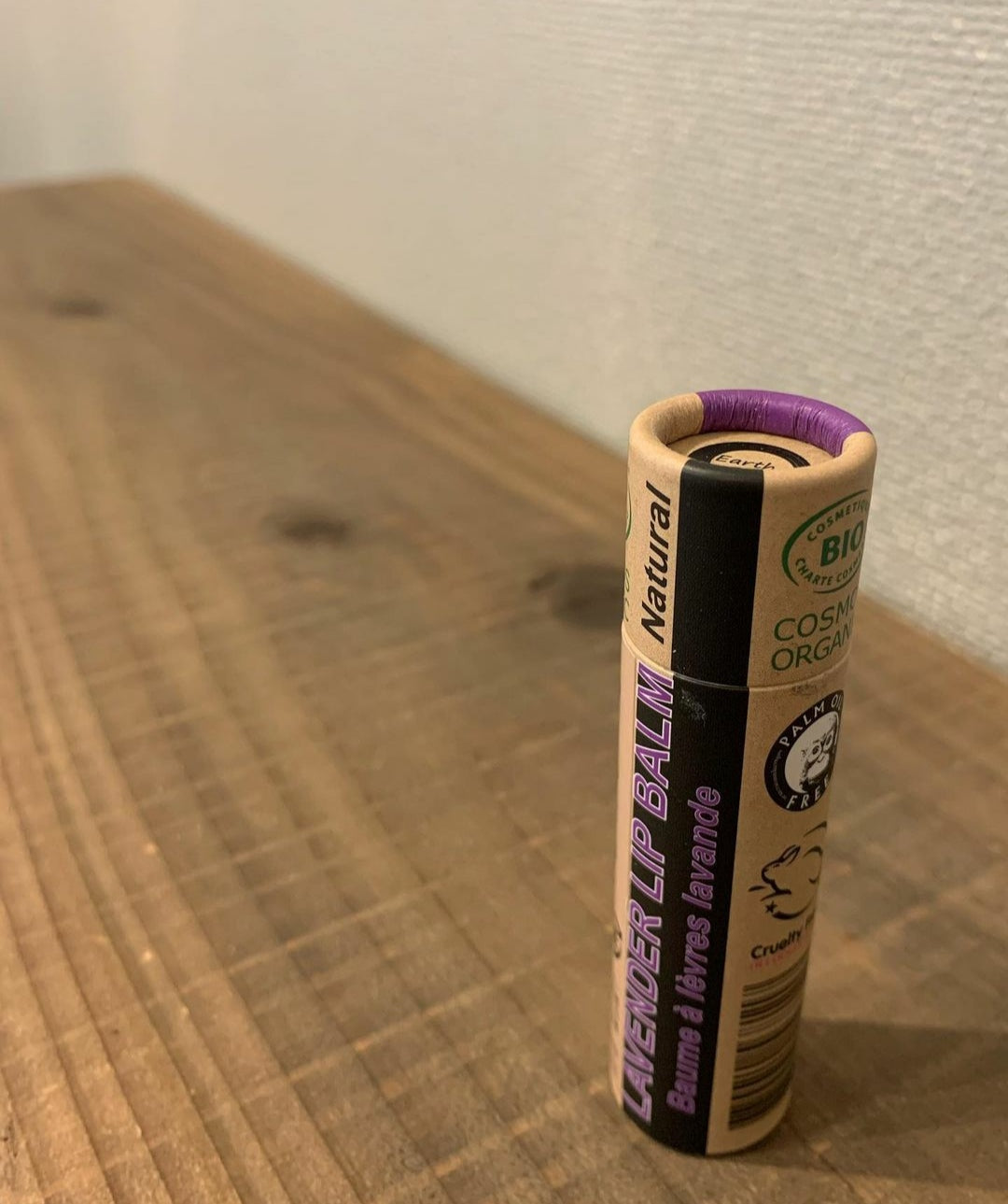 A collection of 30 x 15ml Organic Lavender Lip Balms in eco-friendly packaging, showcasing their natural ingredients and soothing lavender scent.