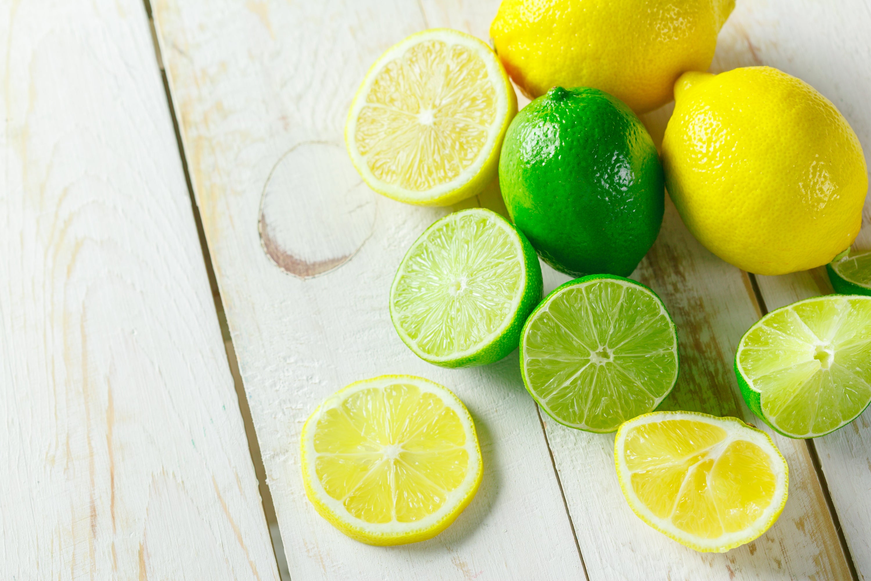 A collection of 30 x 15ml Organic Lime Lip Balms in eco-friendly packaging, showcasing their vibrant green color and natural ingredients.