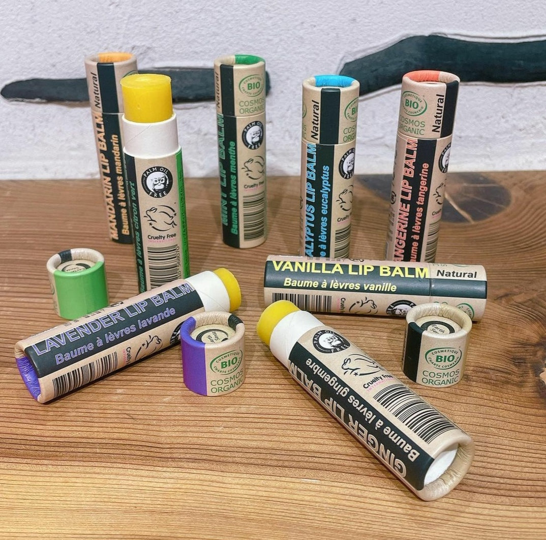 A collection of 30 x 15ml Organic Lime Lip Balms in eco-friendly packaging, showcasing their vibrant green color and natural ingredients.