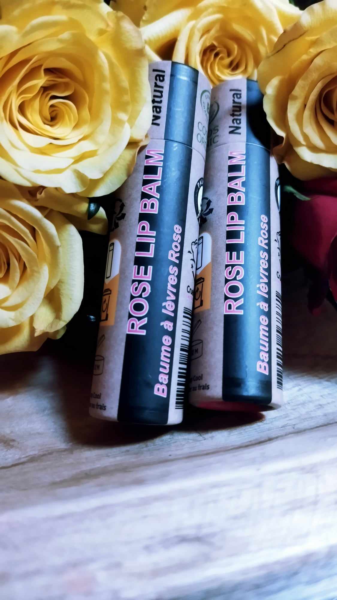 A collection of 30 tubes of 15ml Organic Rose Lip Balm, showcasing their eco-friendly packaging and natural ingredients.