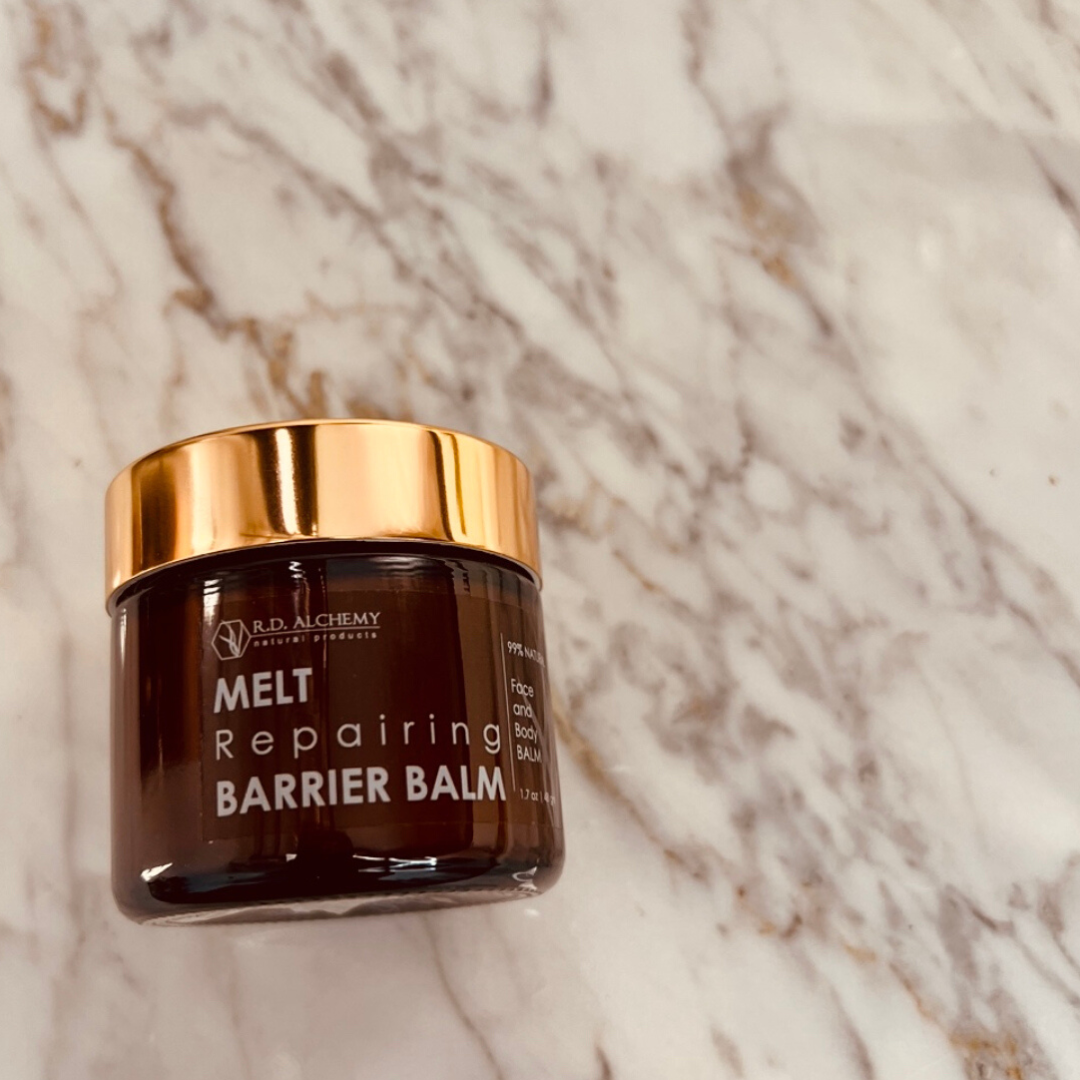 MELT Barrier Balm in a sleek container, showcasing its rich texture and moisturizing properties for dry, damaged skin.