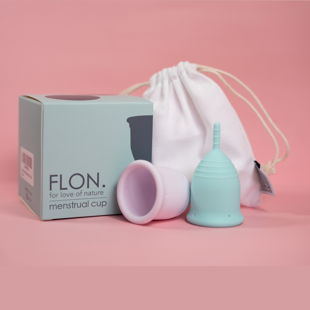 Menstrual Cup Set including two reusable cups, a travel pouch, and a steriliser cup, designed for sustainable period care.