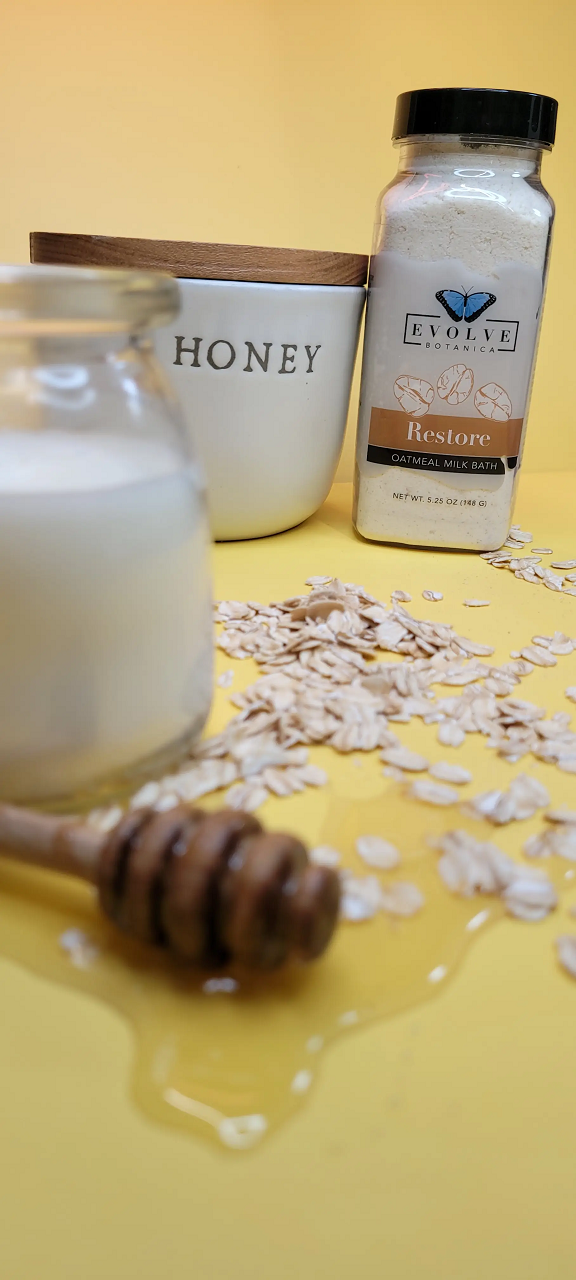 A luxurious Milk Bath - Restore package featuring oatmeal and lavender blend, with ingredients like coconut milk and colloidal oatmeal.