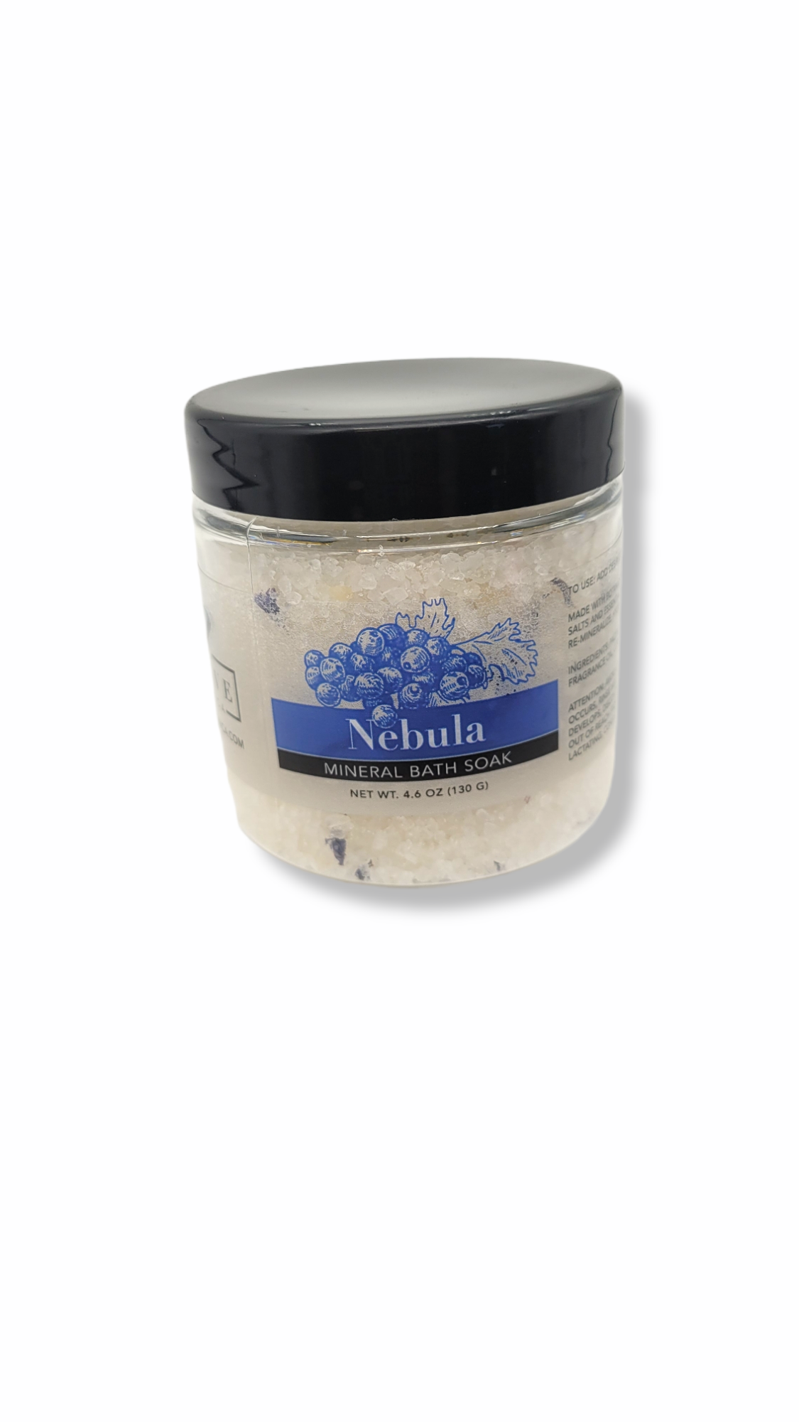 A jar of Mineral Soak - Nebula bath salt featuring a blend of colorful salts and botanical flowers, perfect for a relaxing bath experience.