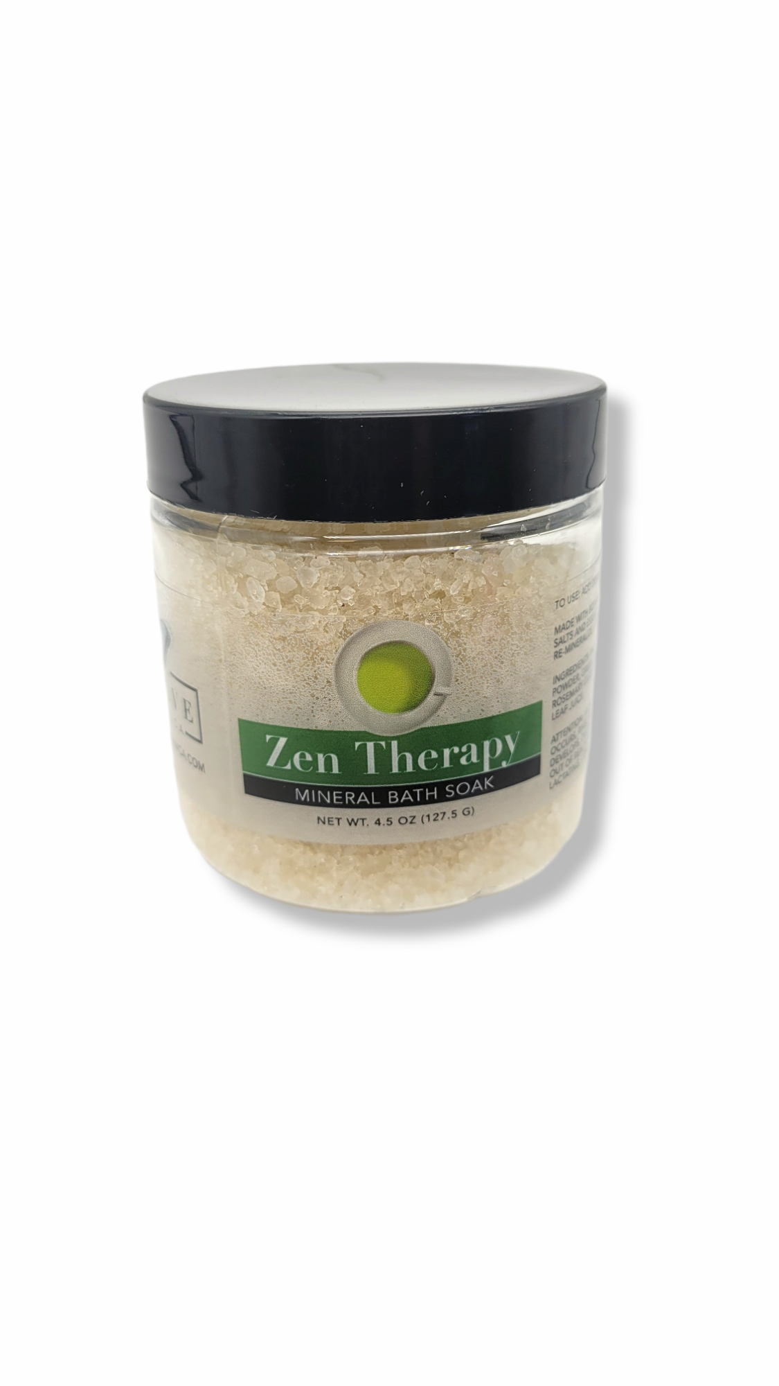 A jar of Mineral Soak - Zen bath salt featuring a blend of dead sea salts, lavender, and rosemary essential oils, surrounded by natural elements.