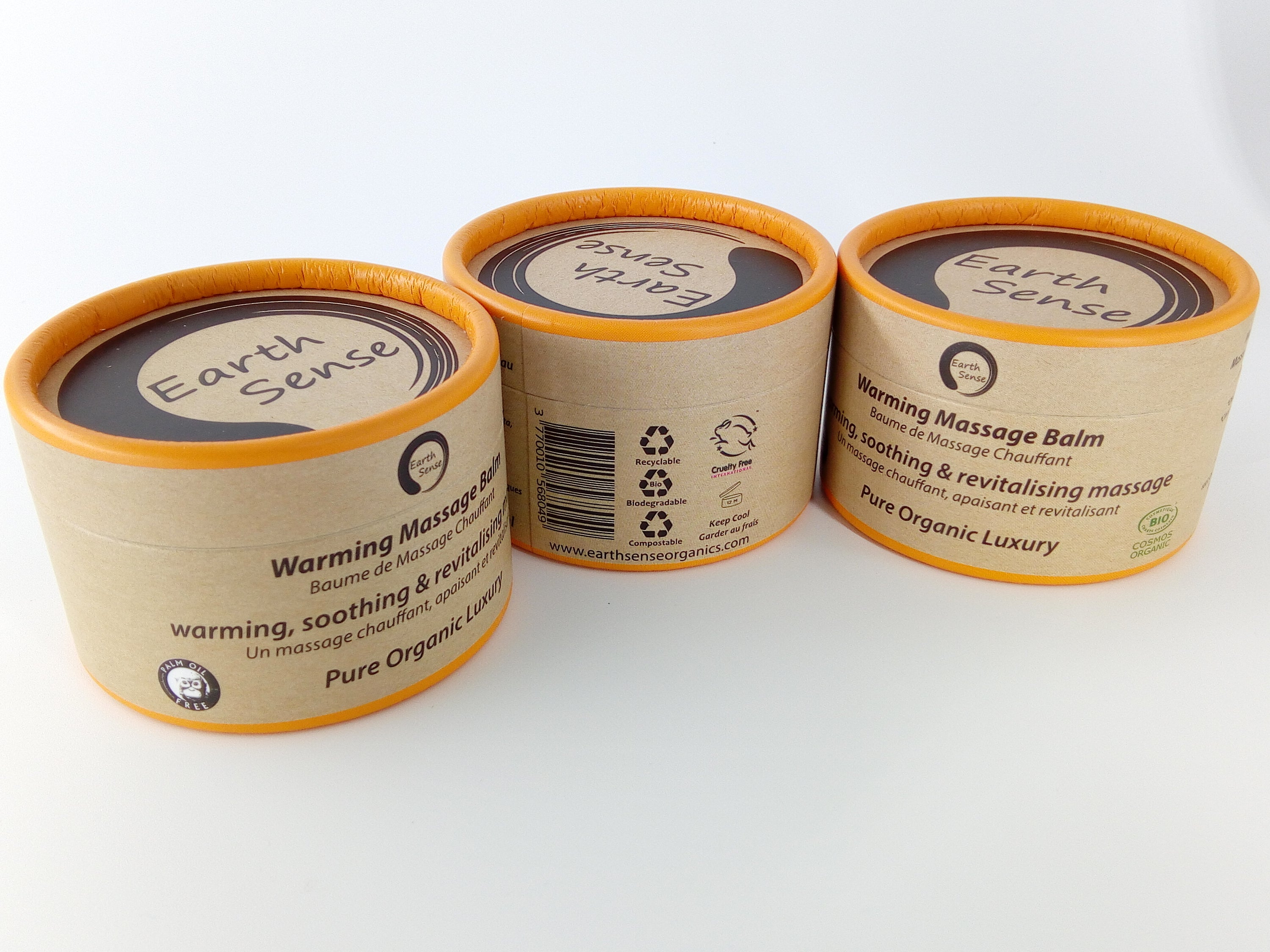 Three jars of 100ml Organic Warming Massage Balm in eco-friendly packaging, showcasing natural ingredients.