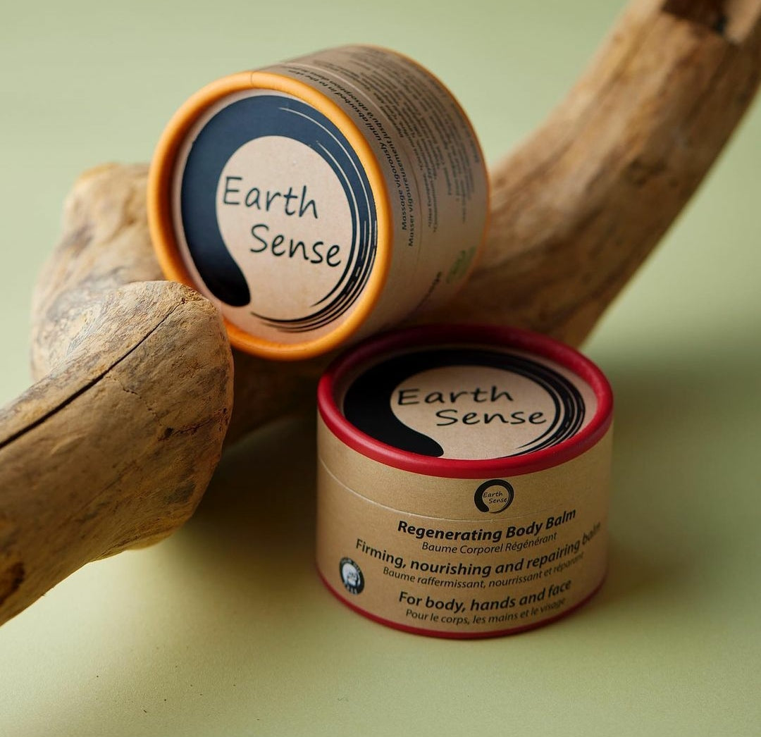 Three jars of 100ml Organic Warming Massage Balm in eco-friendly packaging, showcasing natural ingredients.