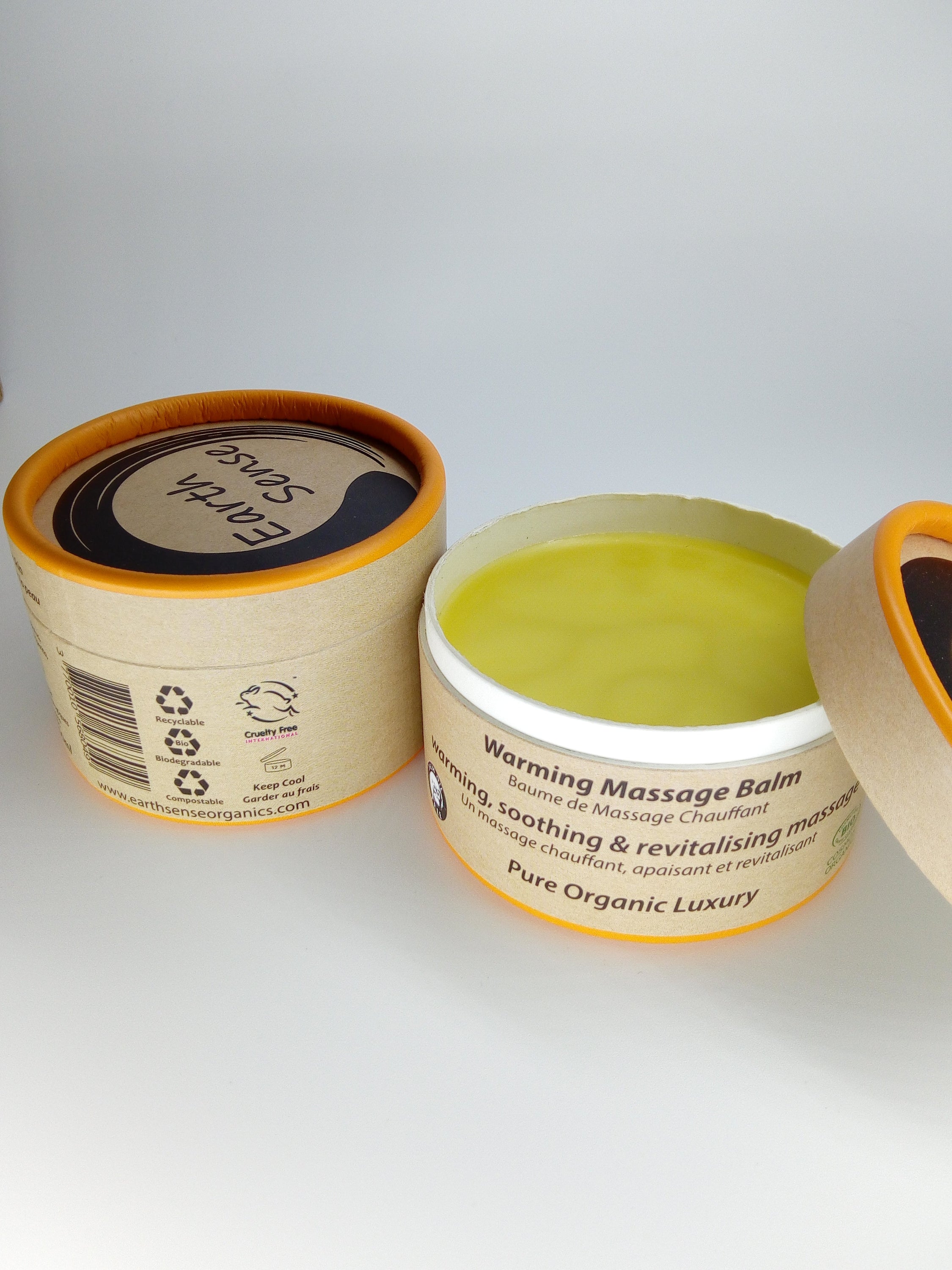 Three jars of 100ml Organic Warming Massage Balm in eco-friendly packaging, showcasing natural ingredients.