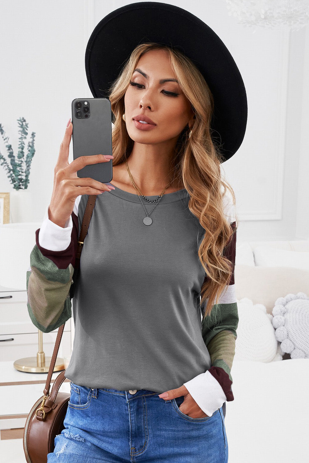 Monochrome plaid long sleeves black pullover top featuring colorblocked sleeves and a round neckline, perfect for casual and stylish outfits.