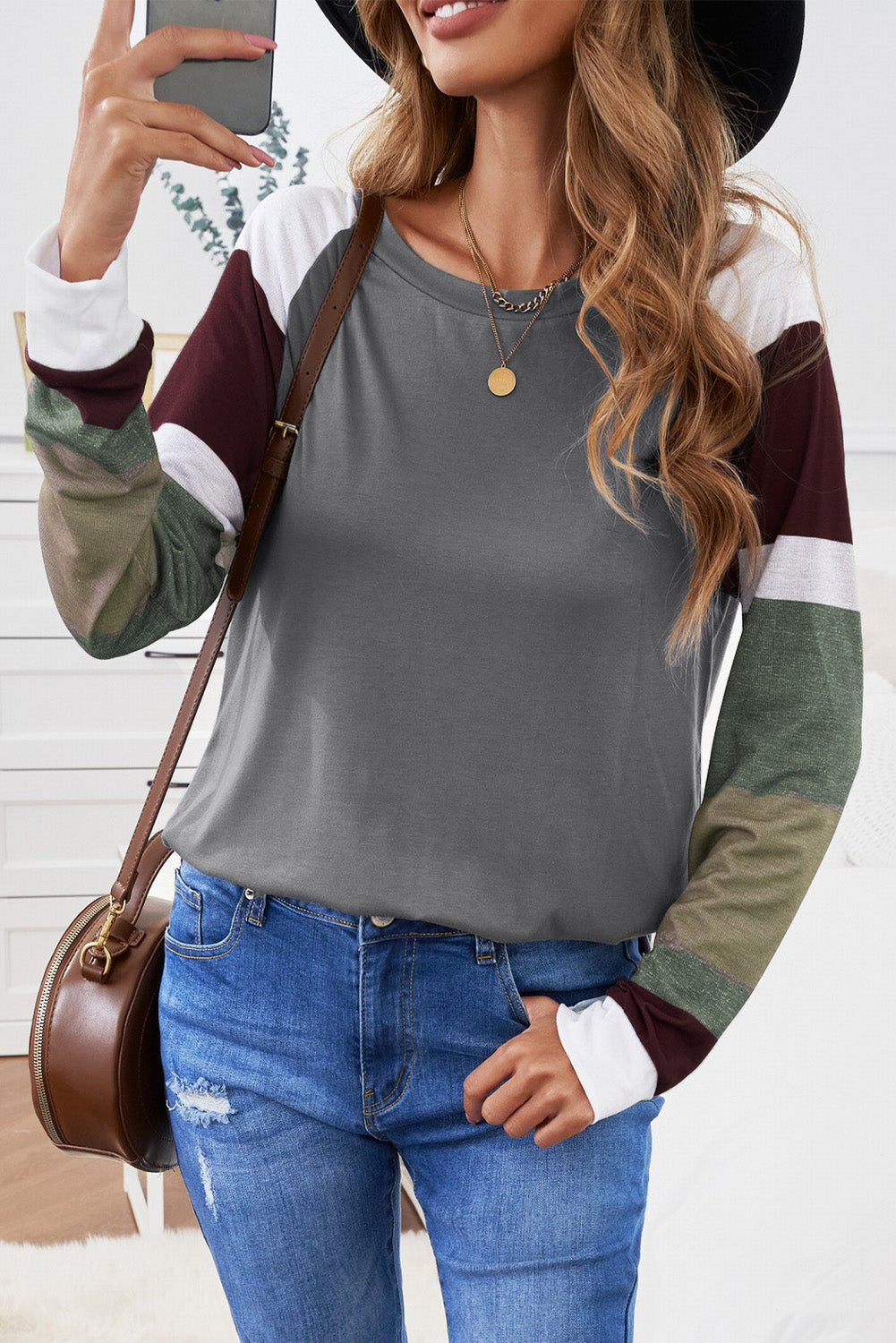 Monochrome plaid long sleeves black pullover top featuring colorblocked sleeves and a round neckline, perfect for casual and stylish outfits.