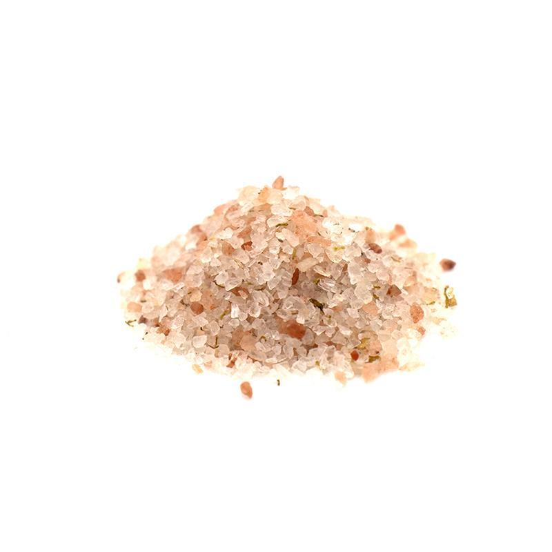 A jar of Morning Sunshine Bath Salts containing mineral-rich Dead Sea salts, surrounded by fresh grapefruit and wheatgerm oil ingredients.