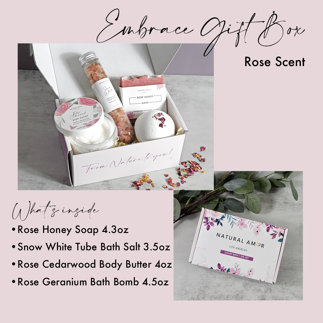 Mother's Embrace gift box featuring vegan skincare products including soap, bath salt, body butter, and bath bomb in rose and lavender scents.