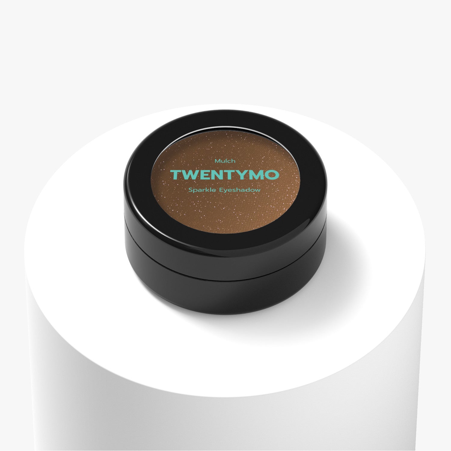 A compact of Mulch eyeshadow showcasing its silky, creamy texture and shimmering shades, perfect for vibrant eye looks.