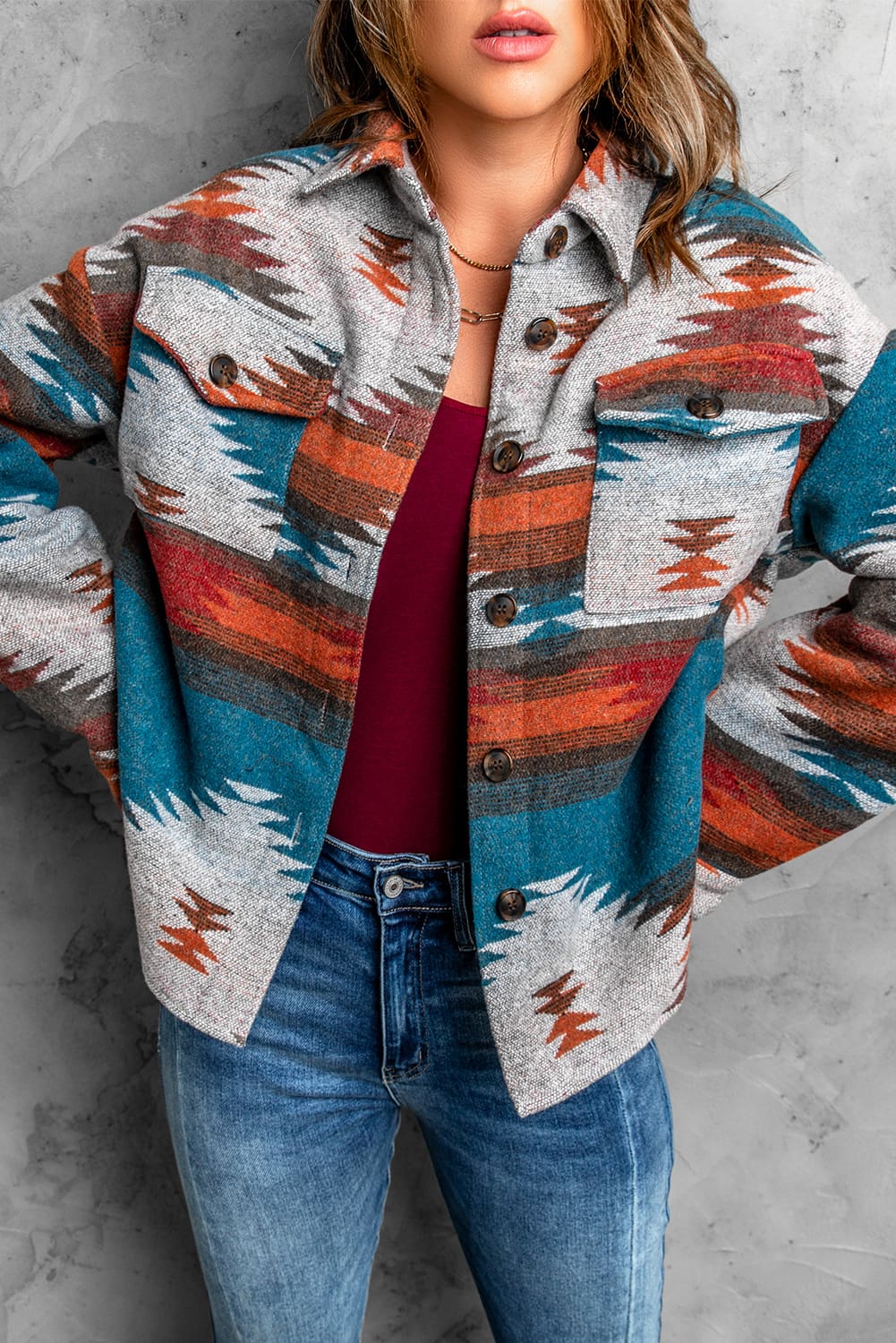 Multicolor Aztec Print Lapel Button Shirt Jacket featuring geometric patterns and two chest flap pockets, styled casually.