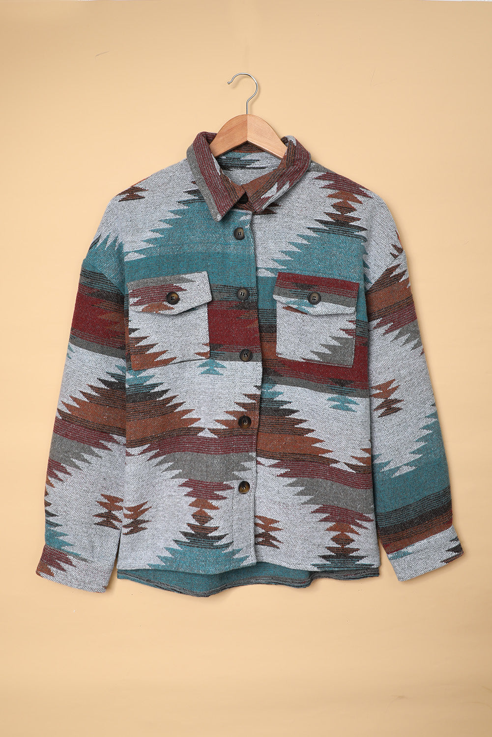 Multicolor Aztec Print Lapel Button Shirt Jacket featuring geometric patterns and two chest flap pockets, styled casually.