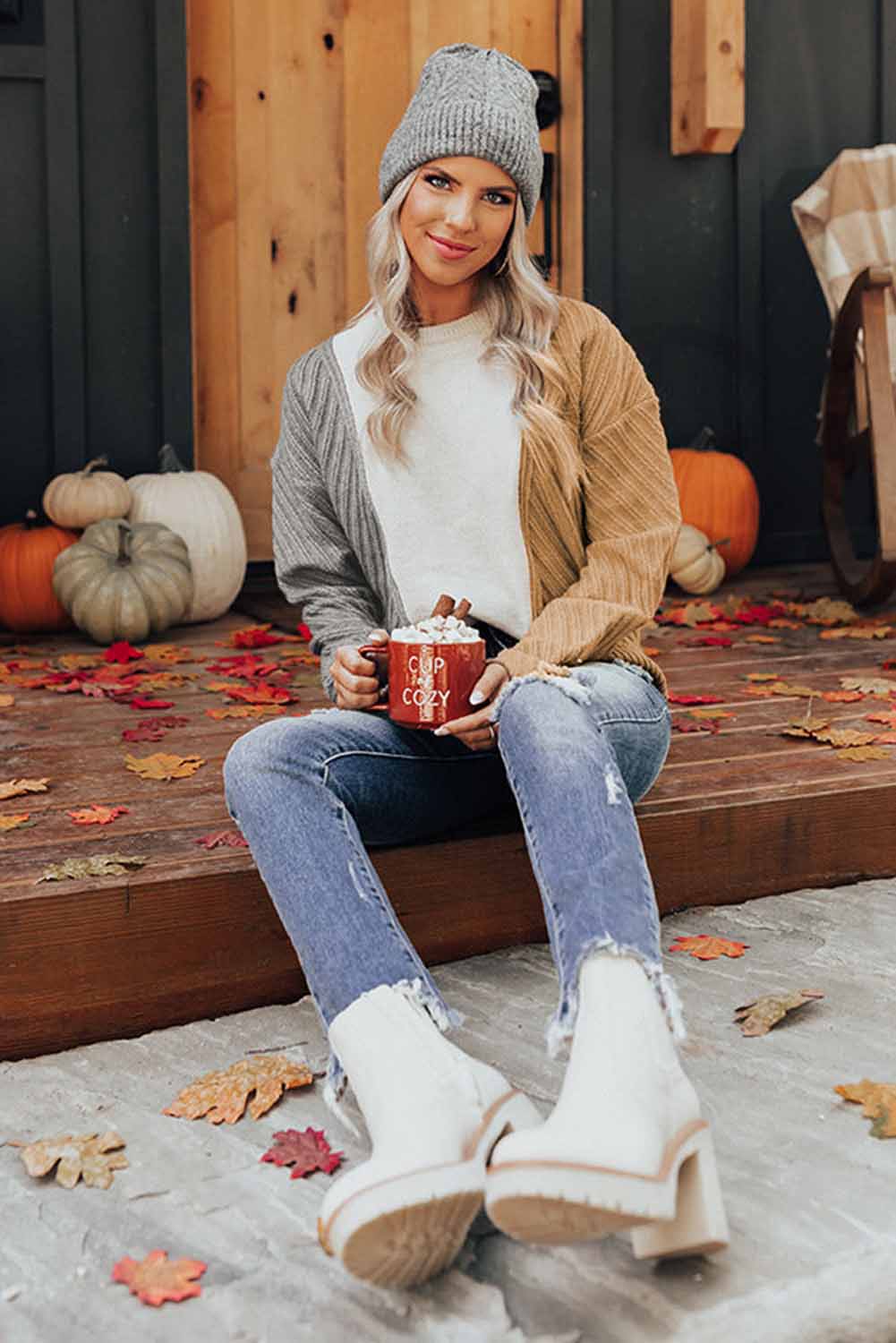 A stylish multicolor colorblock textured drop shoulder sweater displayed on a mannequin, showcasing its unique design and cozy fabric.