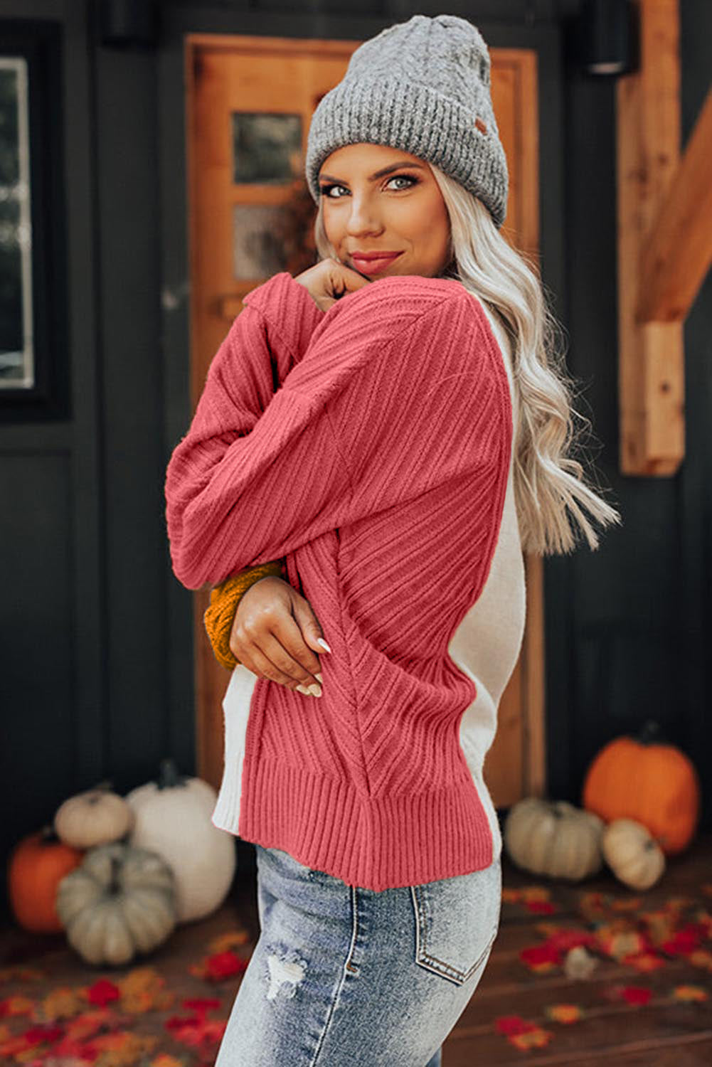 A stylish multicolor colorblock textured drop shoulder sweater displayed on a mannequin, showcasing its unique design and cozy fabric.