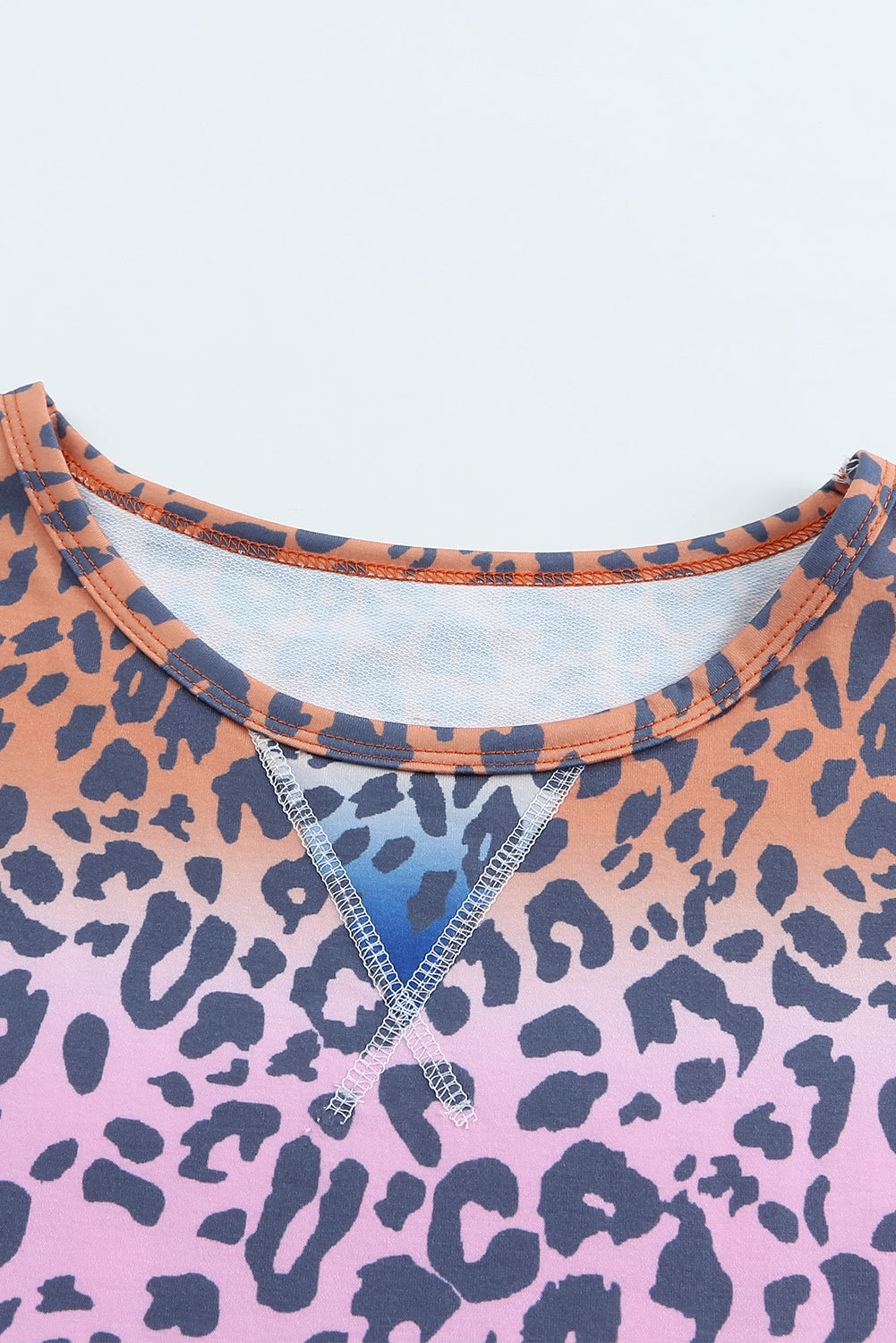 Multicolor gradient leopard print pullover sweatshirt showcasing vibrant colors and stylish design, perfect for casual wear.